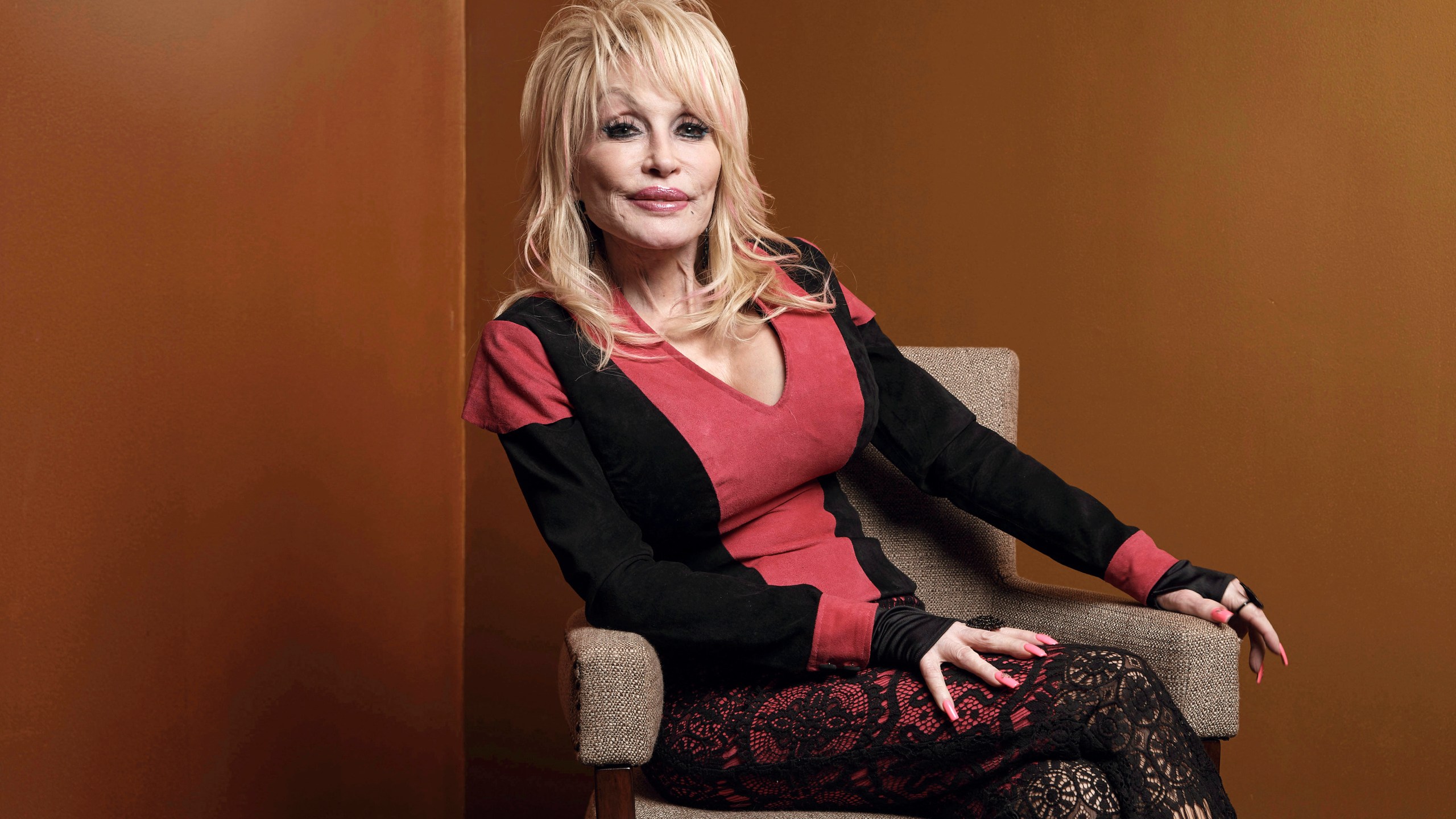 FILE - Dolly Parton poses at the Carnegie Medal of Philanthropy Ceremony in New York on Oct. 13, 2022. (AP Photo/Andres Kudacki, File)