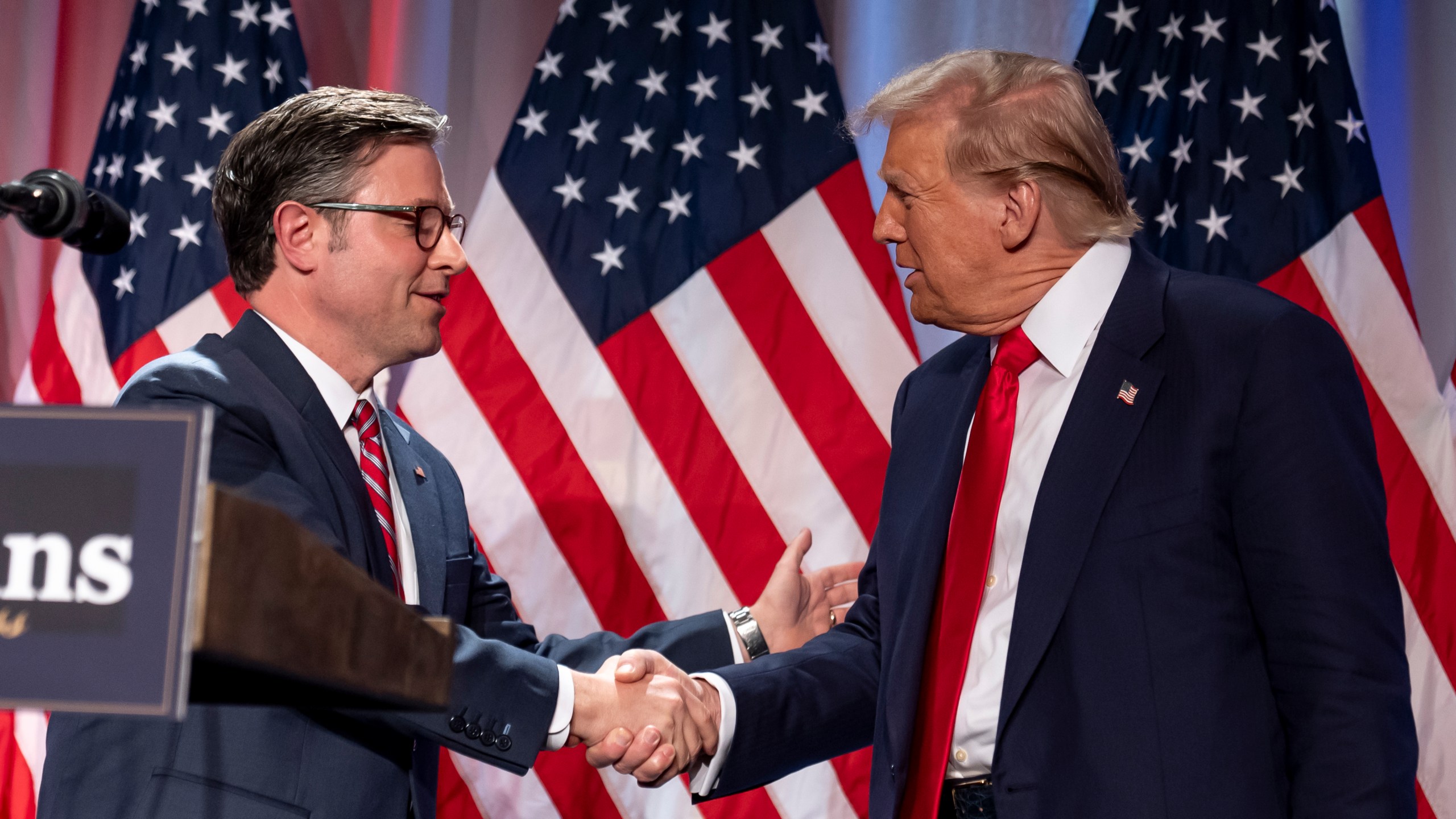 President-elect Donald Trump shakes hands with House Speaker Mike Johnson of La., as he arrives to speak at a meeting with the House GOP conference, Wednesday, Nov. 13, 2024, in Washington. (AP Photo/Alex Brandon)