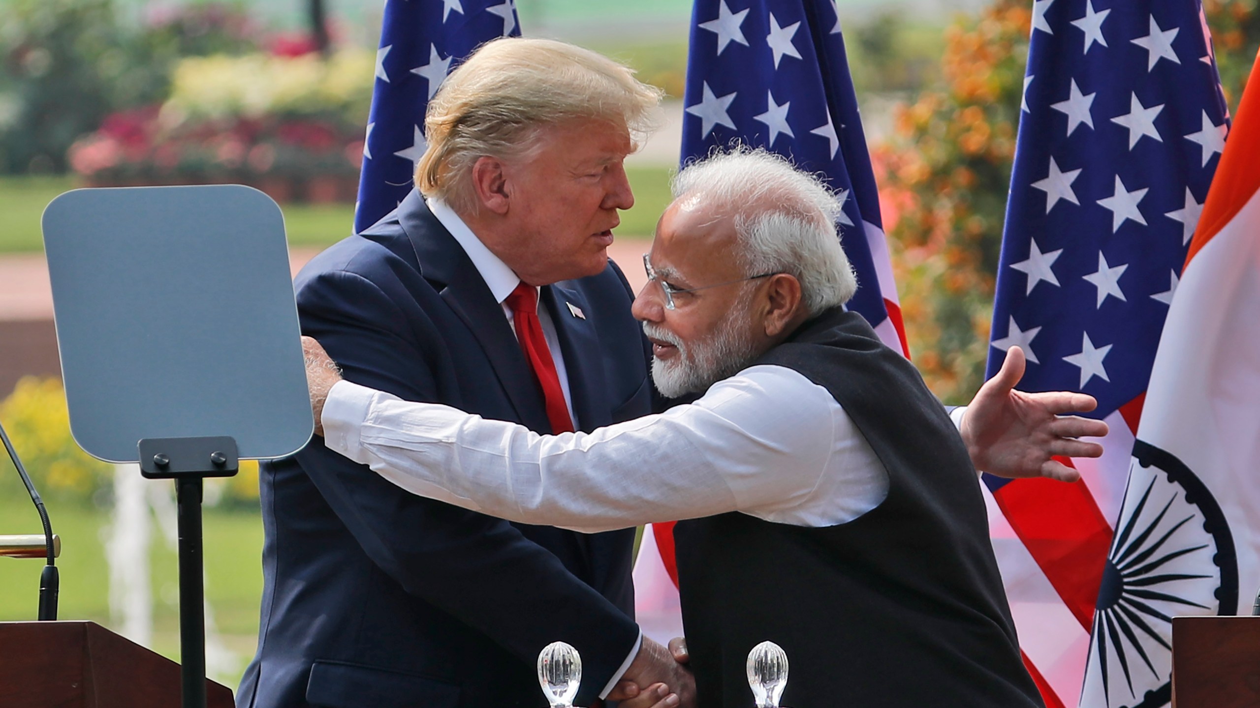 FILE - U.S. President Donald Trump, left and Indian Prime Minister Narendra Modi embrace after giving a joint statement in New Delhi, India, Feb. 25, 2020. (AP Photo/Manish Swarup, File)