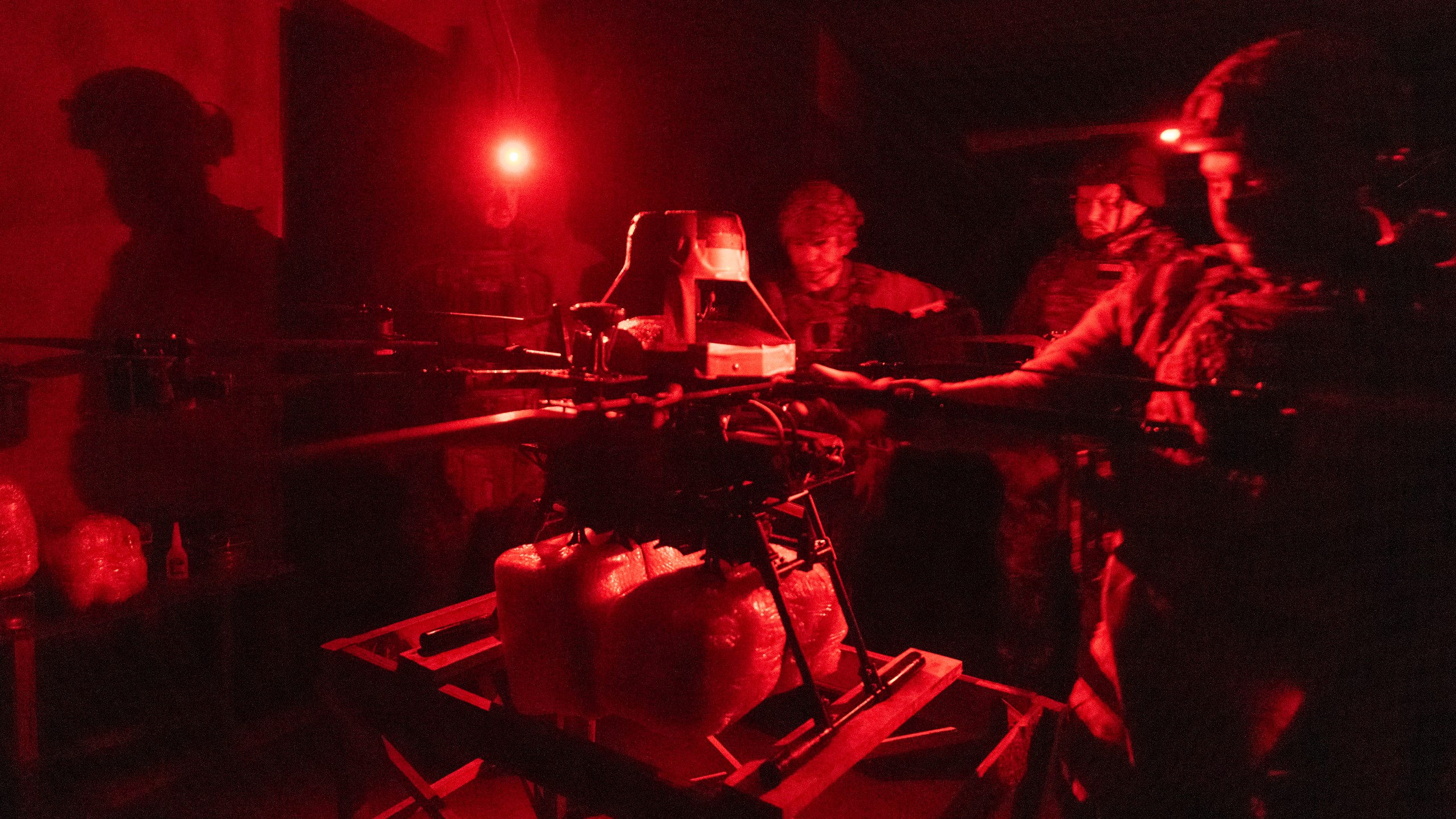 Servicemen of Ukraine's Khartia brigade pack a Vampire drone with food and water to launch toward the frontline to Ukrainian positions near Kharkiv, Ukraine, late Thursday, Nov. 7, 2024. (AP Photo/Efrem Lukatsky)