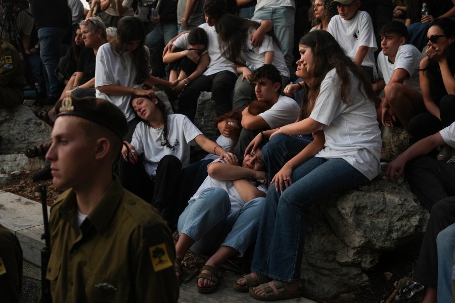 Mourners react during eulogies for Israeli soldier Capt. Itay Marcovich, who was killed in action in Lebanon, during his funeral in Kokhav Yair, Israel, Thursday, Nov. 14, 2024. (AP Photo/Ohad Zwigenberg)