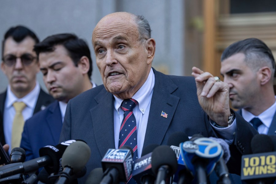 Former New York City Mayor Rudy Giuliani speaks to the members of the media as he leaves court in New York, Thursday, Nov. 7, 2024. (AP Photo/Yuki Iwamura)