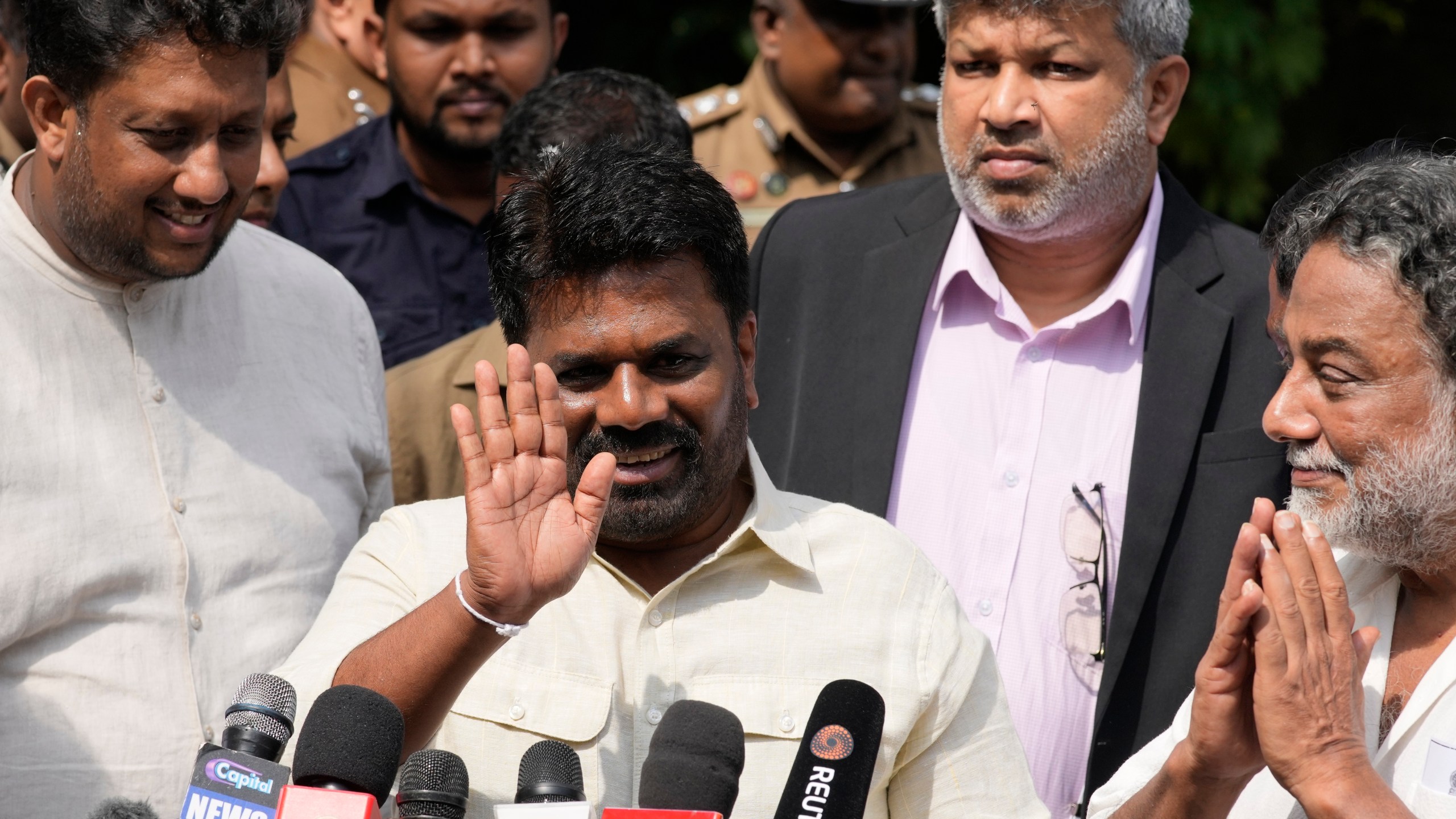 Sri Lankan President Anura Kumara Dissanayake leaves after casting his vote during the parliamentary election in Colombo, Sri Lanka, Thursday, Nov. 14, 2024.(AP Photo/Eranga Jayawardena)