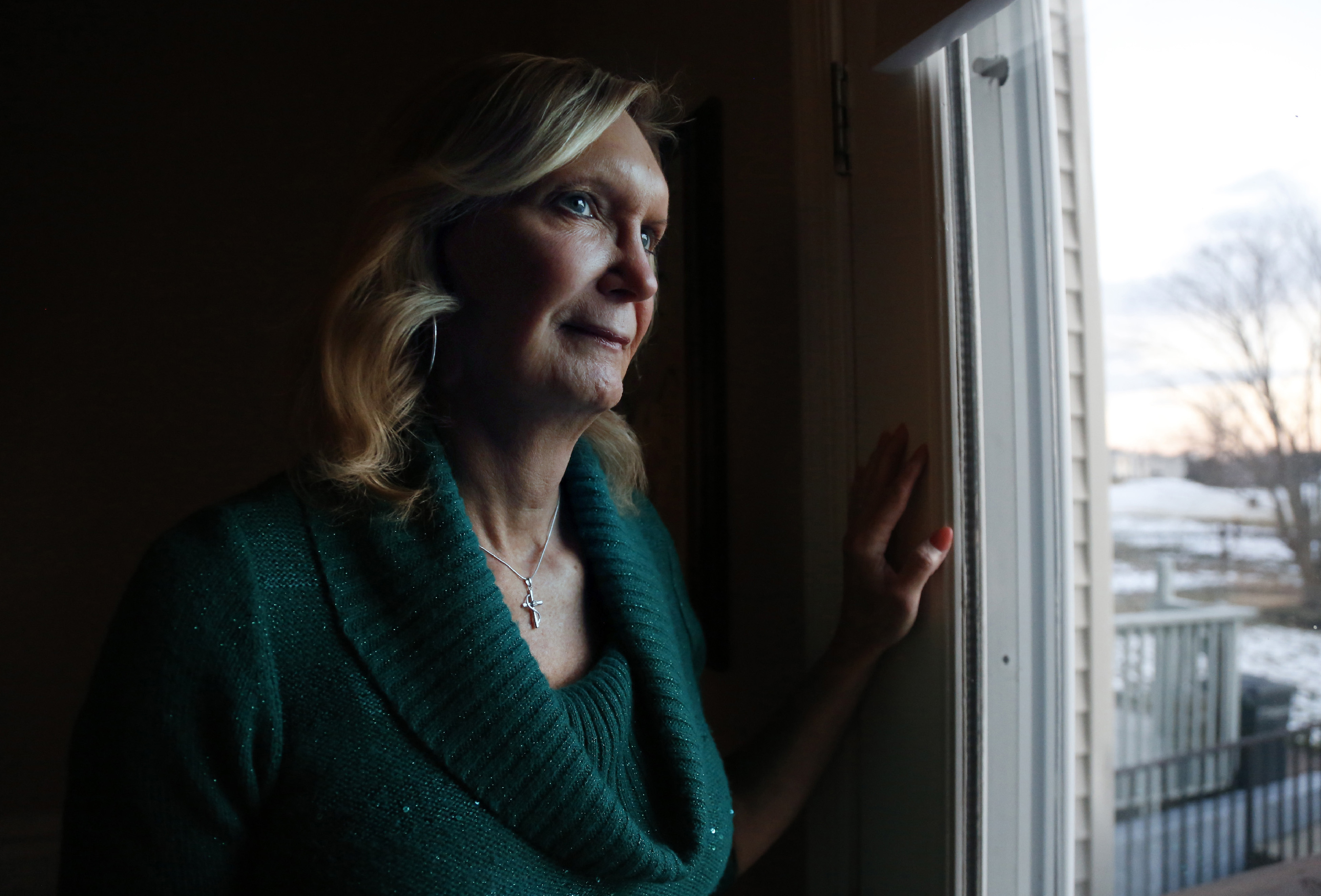 FILE - Christine Zuba, who came out as a transgender woman at age 58, stands for a portrait at her home in Blackwood, N.J., on Monday, Feb. 14, 2022. (AP Photo/Jessie Wardarski, File)