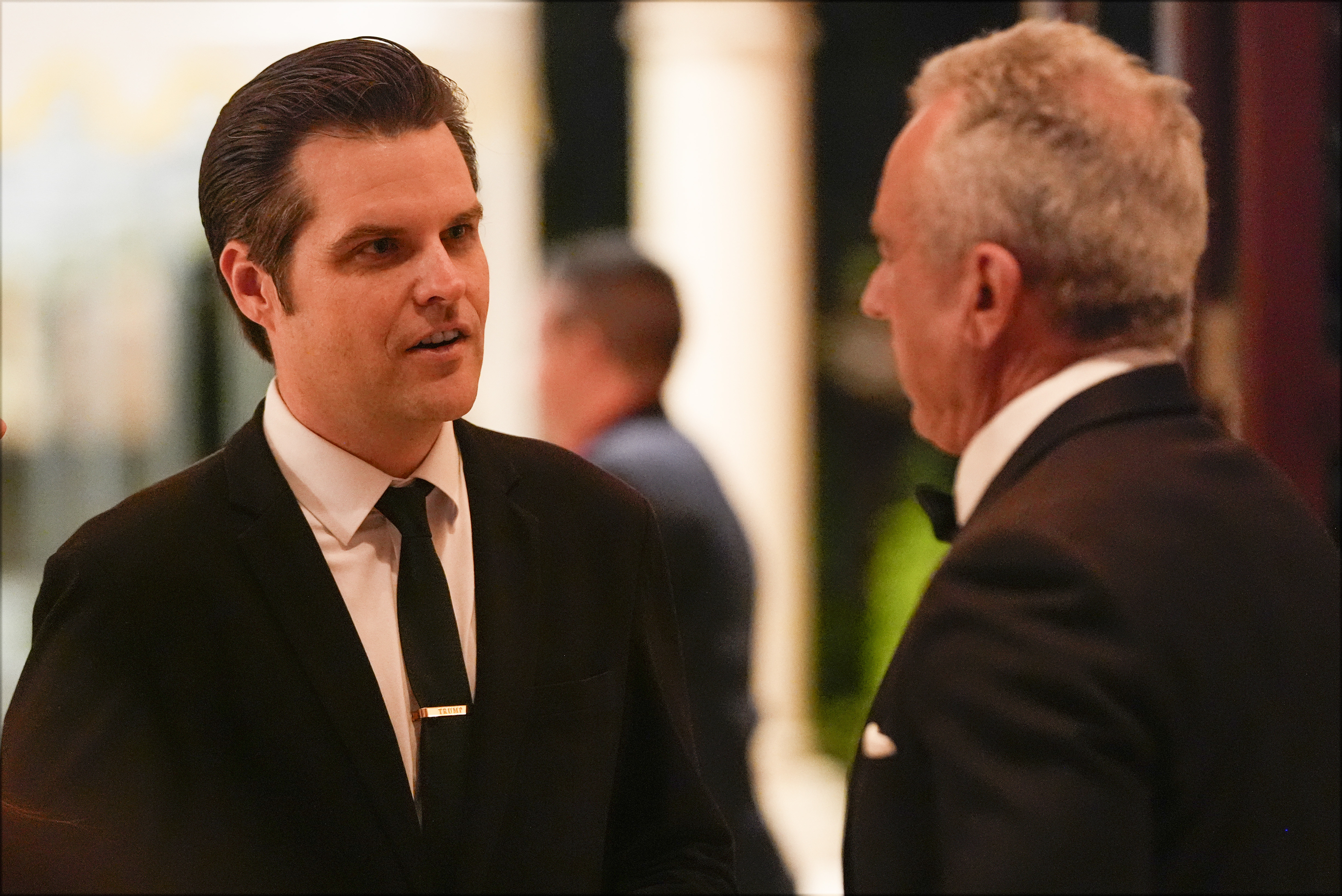 Matt Gaetz talks with Robert F. Kennedy Jr., before President-elect Donald Trump speaks during an America First Policy Institute gala at his Mar-a-Lago estate, Thursday, Nov. 14, 2024, in Palm Beach, Fla. (AP Photo/Alex Brandon)