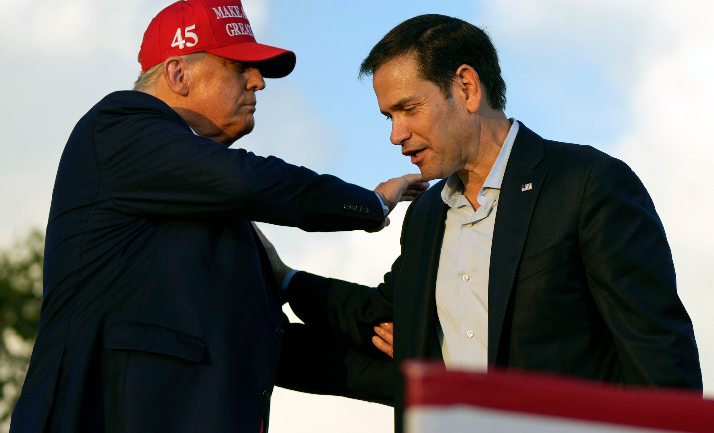 FILE - Then former President Donald Trump pats Sen. Marco Rubio, R-Fla., on the shoulder during a campaign rally at the Miami-Dade County Fair and Exposition in Miami, Nov. 6, 2022. (AP Photo/Rebecca Blackwell, File)