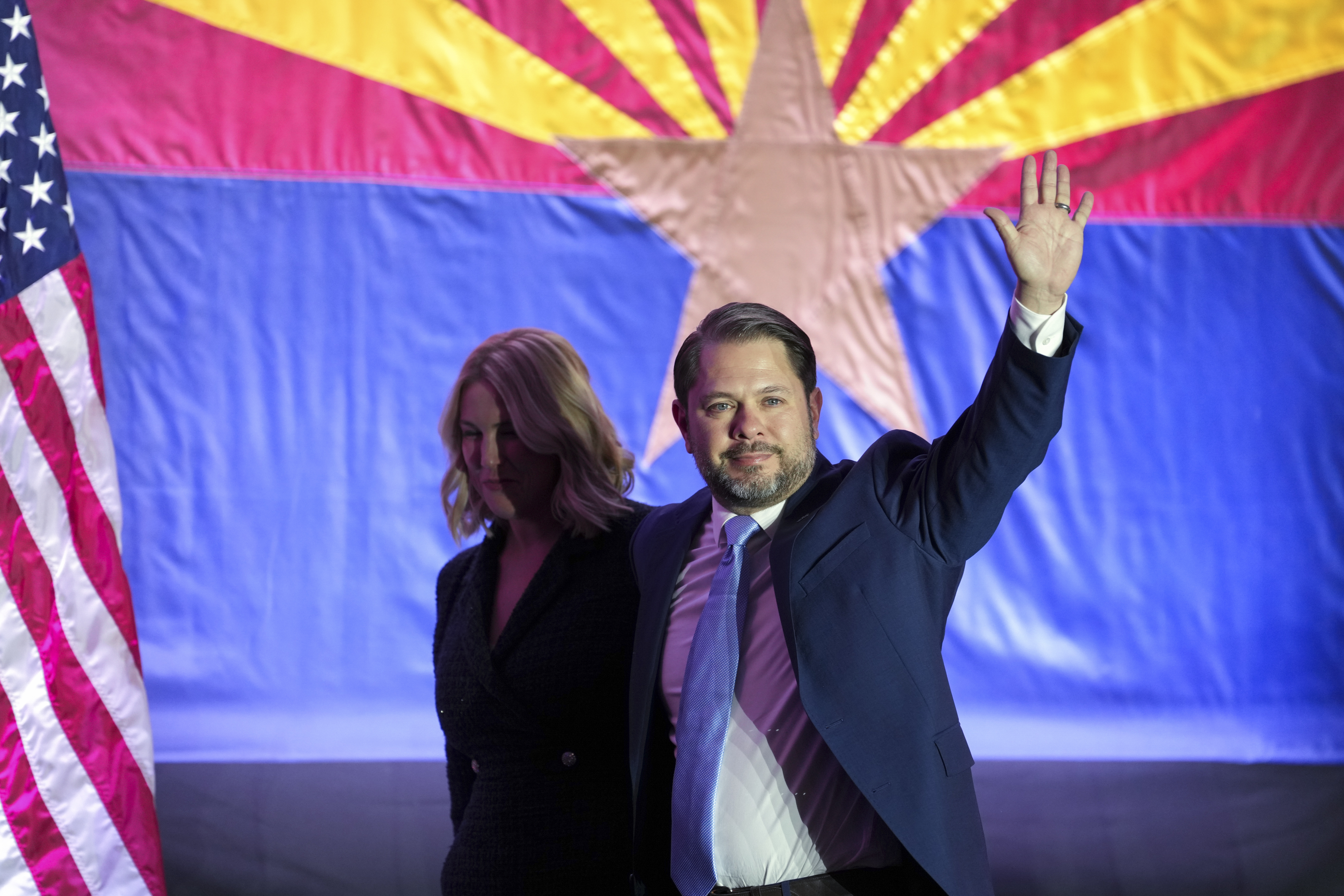 Arizona Democratic Senate candidate Rep. Ruben Gallego, D-Ariz., waves to the crowd as he leaves the stage his wife Sydney Gallego after speaking during a watch party on election night Tuesday, Nov. 5, 2024, in Phoenix. (AP Photo/Ross D. Franklin)