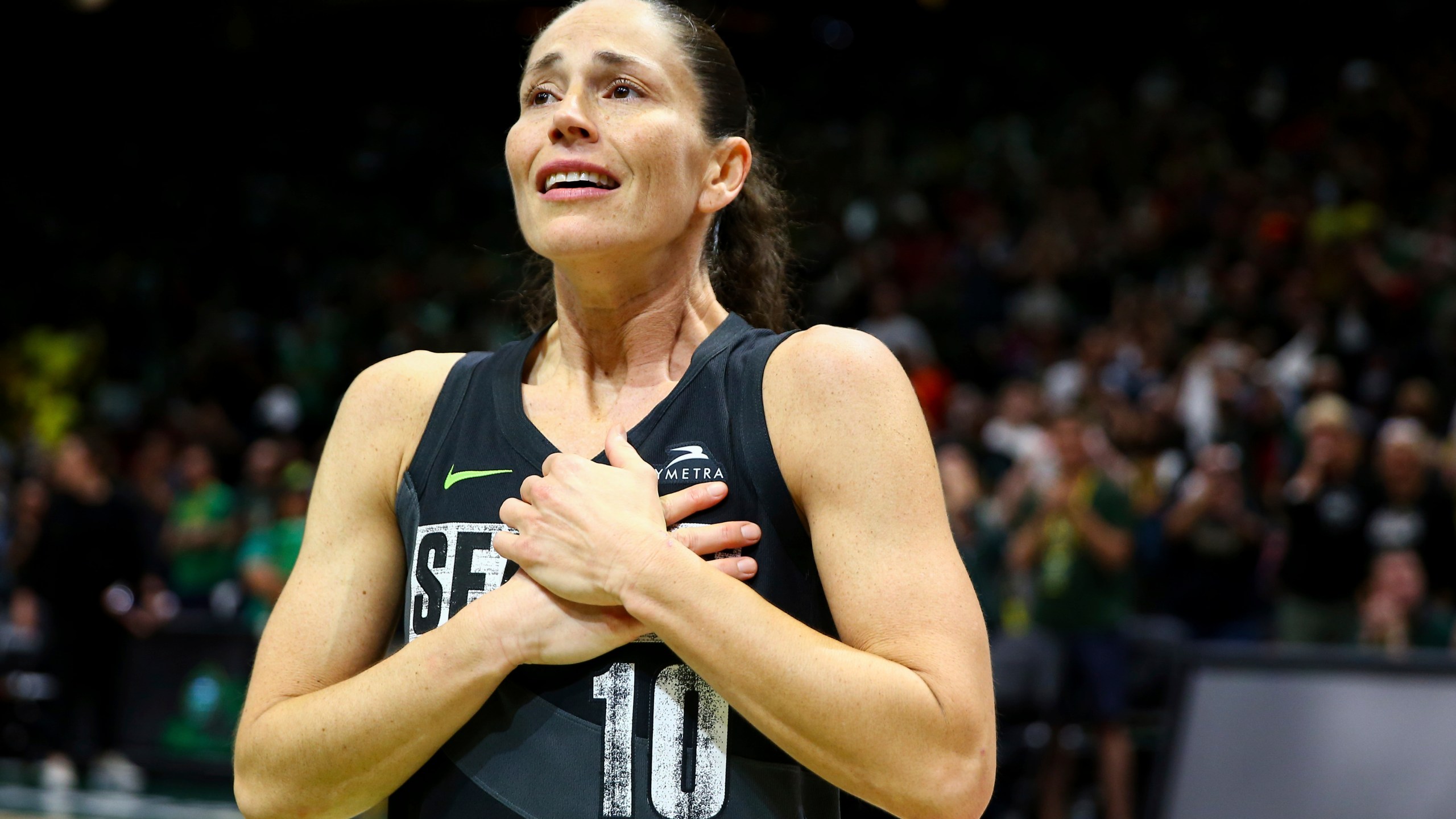 FILE - Seattle Storm guard Sue Bird reacts to fans chanting "Thank you Sue" after the Storm were eliminated from the playoffs with a loss in Game 4 of a WNBA basketball playoff semifinal to the Las Vegas Aces, Tuesday, Sept. 6, 2022, in Seattle. (AP Photo/Lindsey Wasson, File)