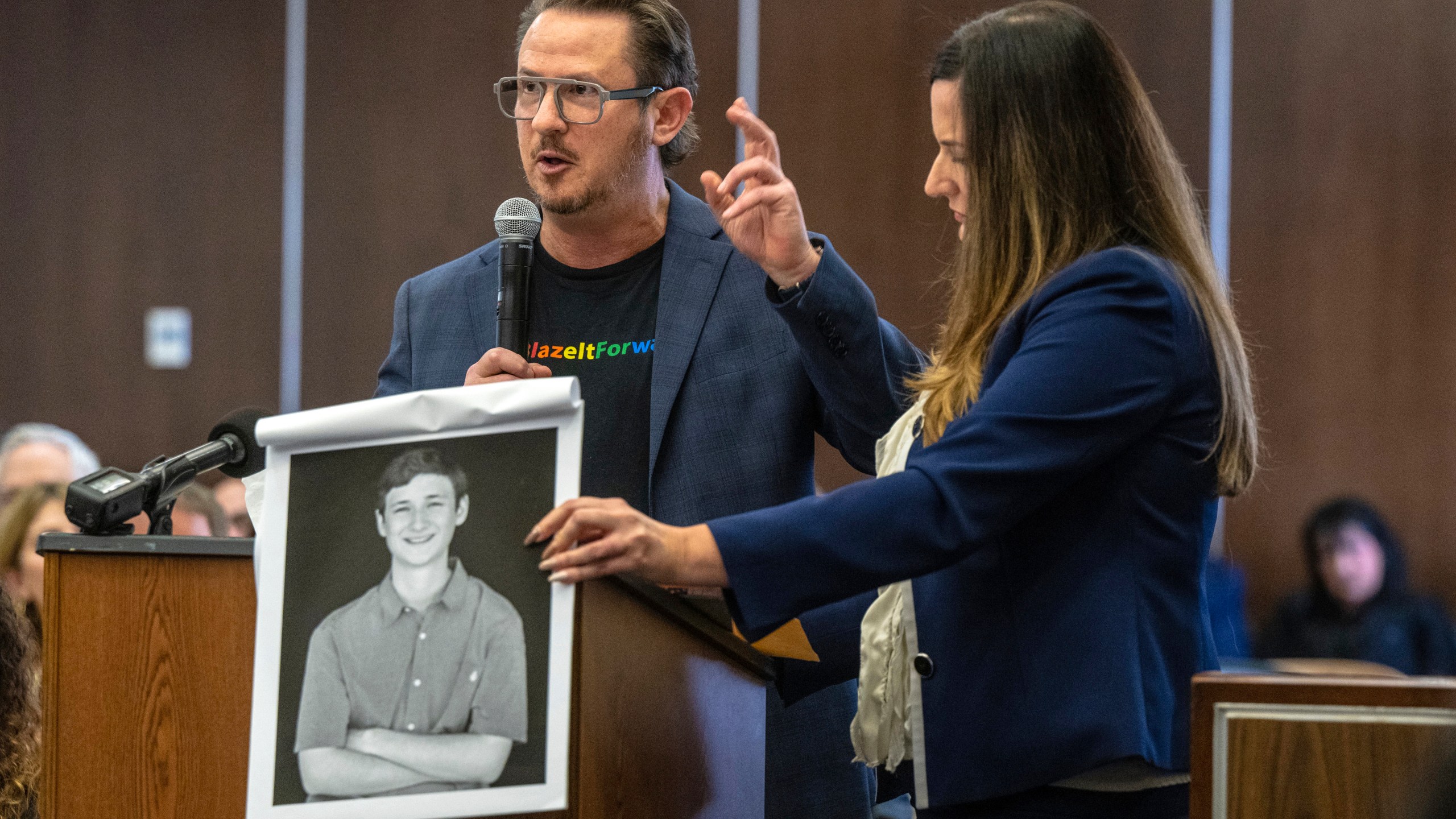 Gideon Bernstein, father of Blaze Bernstein, left, speaks as he gives a victim impact statement in court in Santa Ana, Calif., Friday, Nov. 15, 2024, prior to sentencing of Samuel Woodward, who was convicted of a hate crime murder for the killing of former classmate Blaze Bernstein. Senior Deputy District Attorney Jennifer Walker stands at right. (Mark Rightmire/The Orange County Register via AP, Pool)