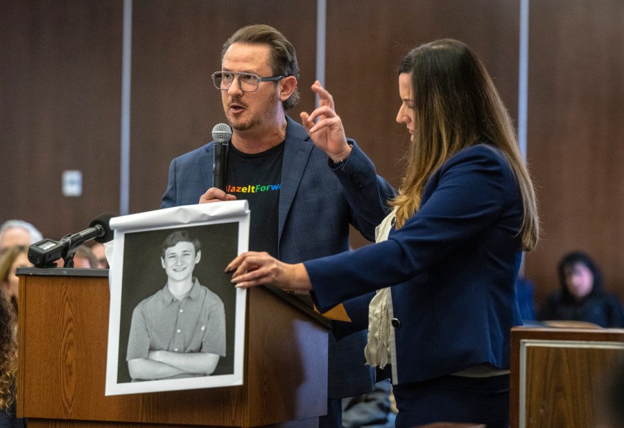 Gideon Bernstein, father of Blaze Bernstein, left, speaks as he gives a victim impact statement in court in Santa Ana, Calif., Friday, Nov. 15, 2024, prior to sentencing of Samuel Woodward, who was convicted of a hate crime murder for the killing of former classmate Blaze Bernstein. Senior Deputy District Attorney Jennifer Walker stands at right. (Mark Rightmire/The Orange County Register via AP, Pool)