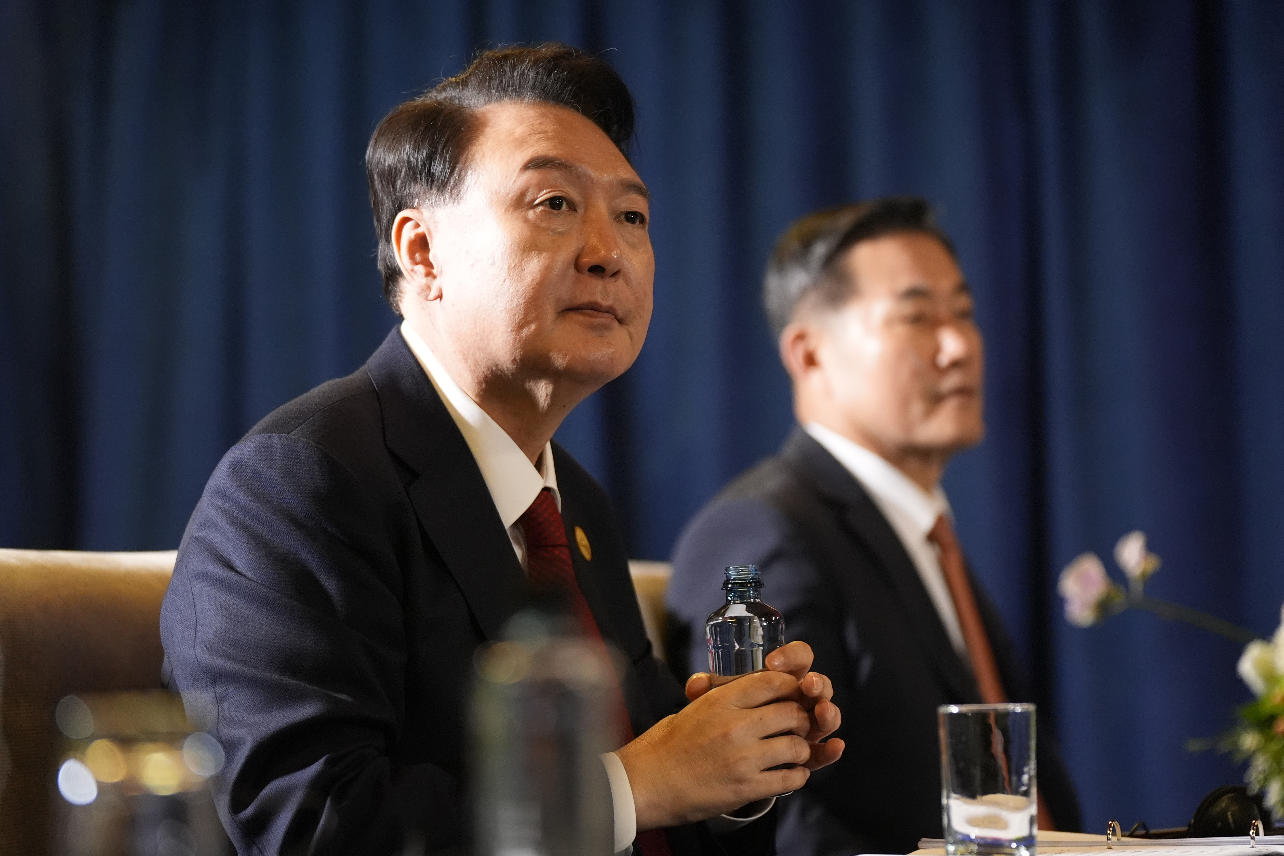 President of South Korea Yoon Suk Yeol listens during a trilateral meeting with President Joe Biden and the Prime Minister of Japan Shigeru Ishiba in Lima, Peru, Friday, Nov. 15, 2024. (AP Photo/Manuel Balce Ceneta)