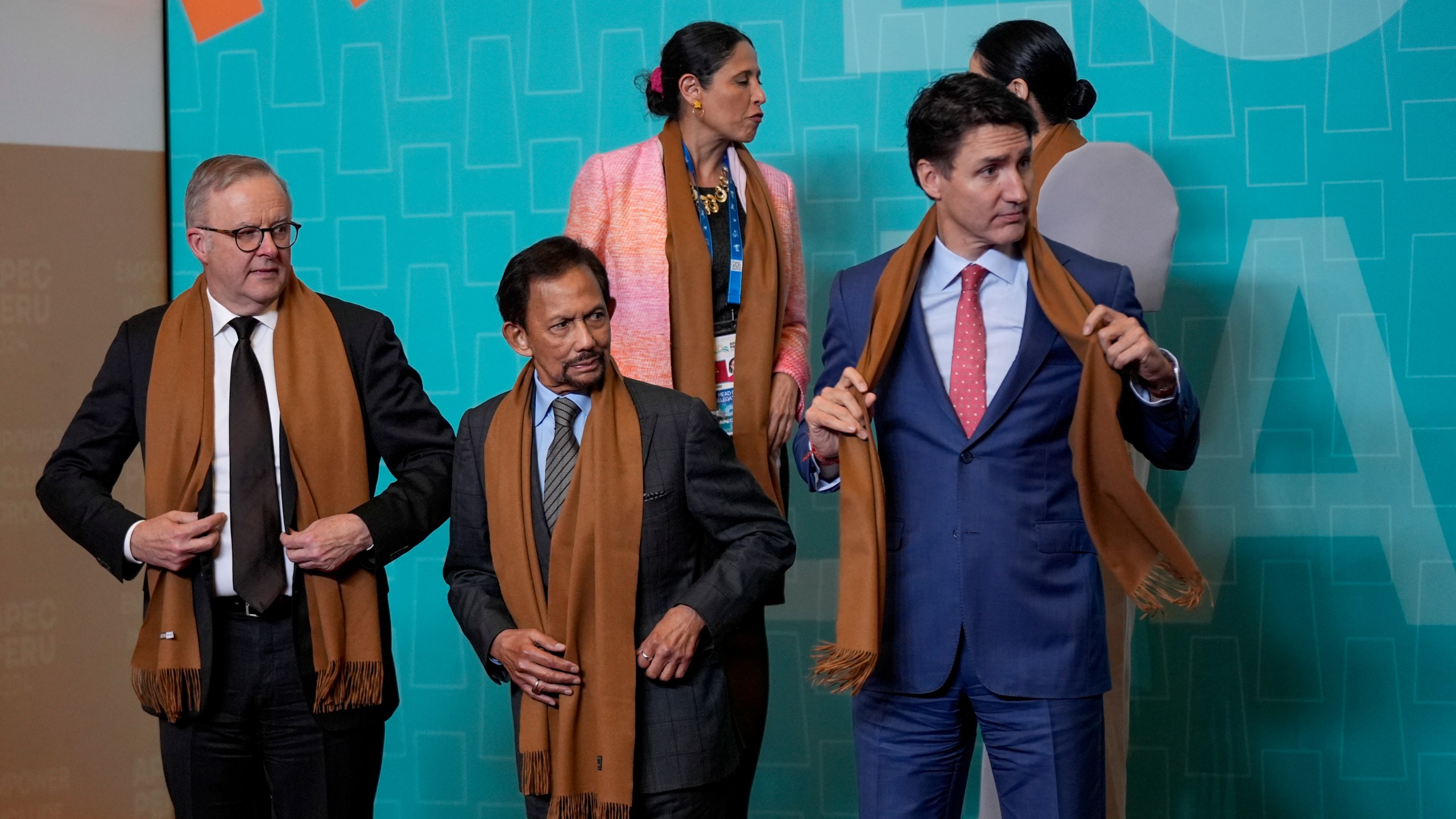 From left, Australia's Prime Minister Anthony Albanese, Brunei's Sultan Hassanal Bolkiah, and Canada's Prime Minister Justin Trudeau gather with other APEC leaders for a family photograph at the APEC Summit in Lima, Peru on Saturday, Nov. 16, 2024. (AP Photo/Manuel Balce Ceneta)