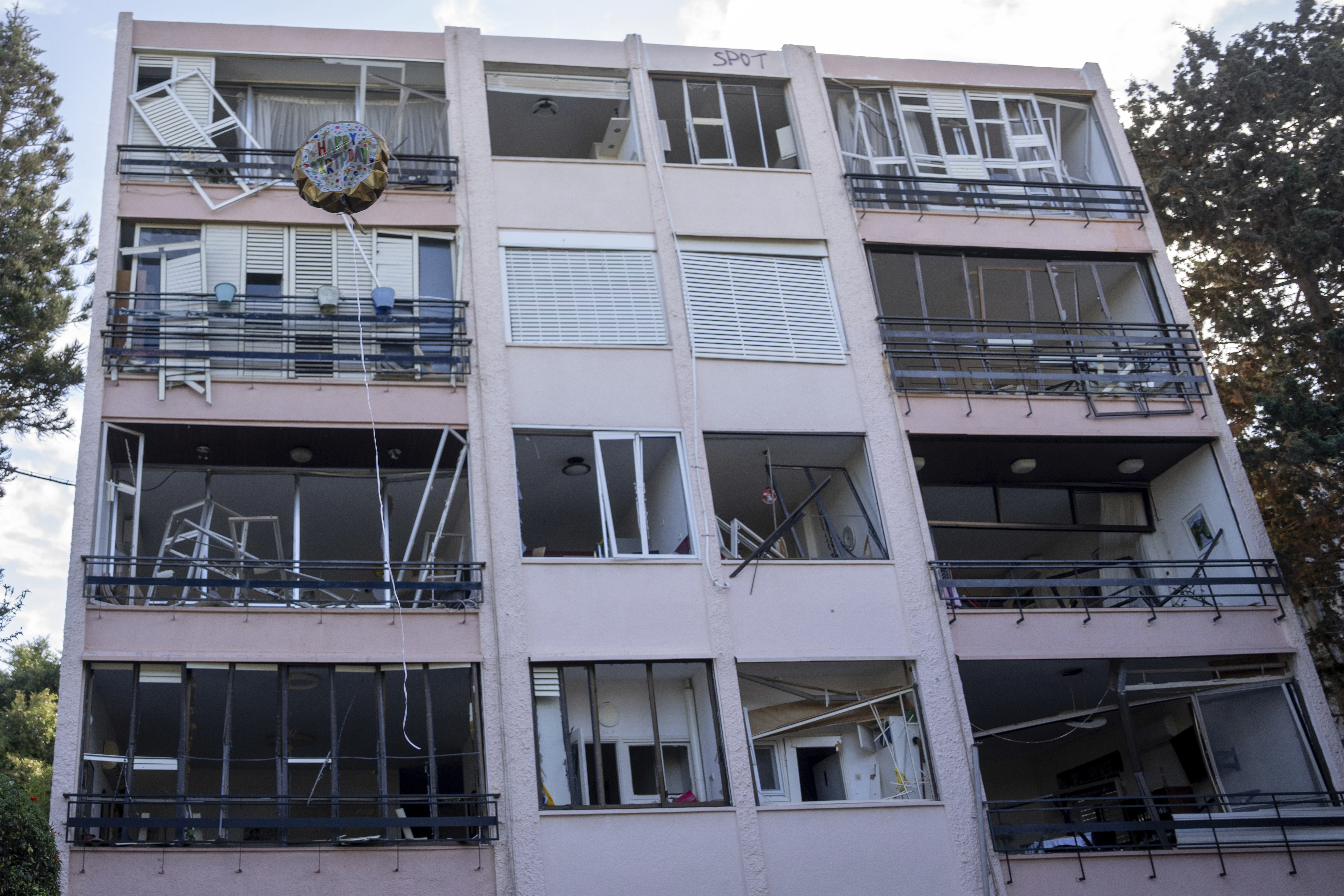 A destroyed building hit by a missile fired from Lebanon on Saturday, in Haifa, northern Israel, Sunday, Nov. 17, 2024. (AP Photo/Ohad Zwigenberg)