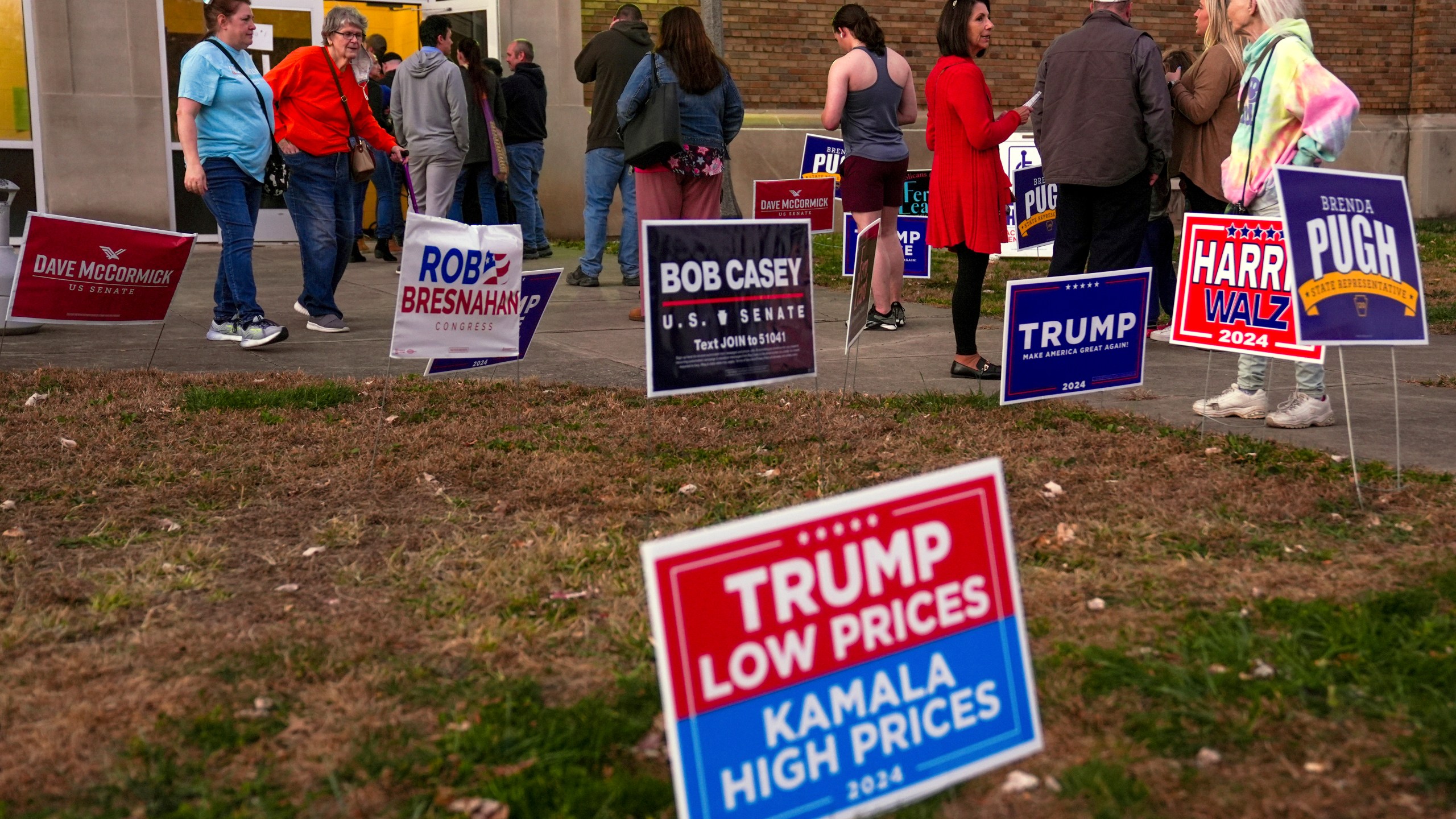 FILE - Voters wait in line to cast their ballots at the Kingston Armory in Wilkes-Barre, Pa, Nov. 5, 2024. (AP Photo/Matt Rourke, File)