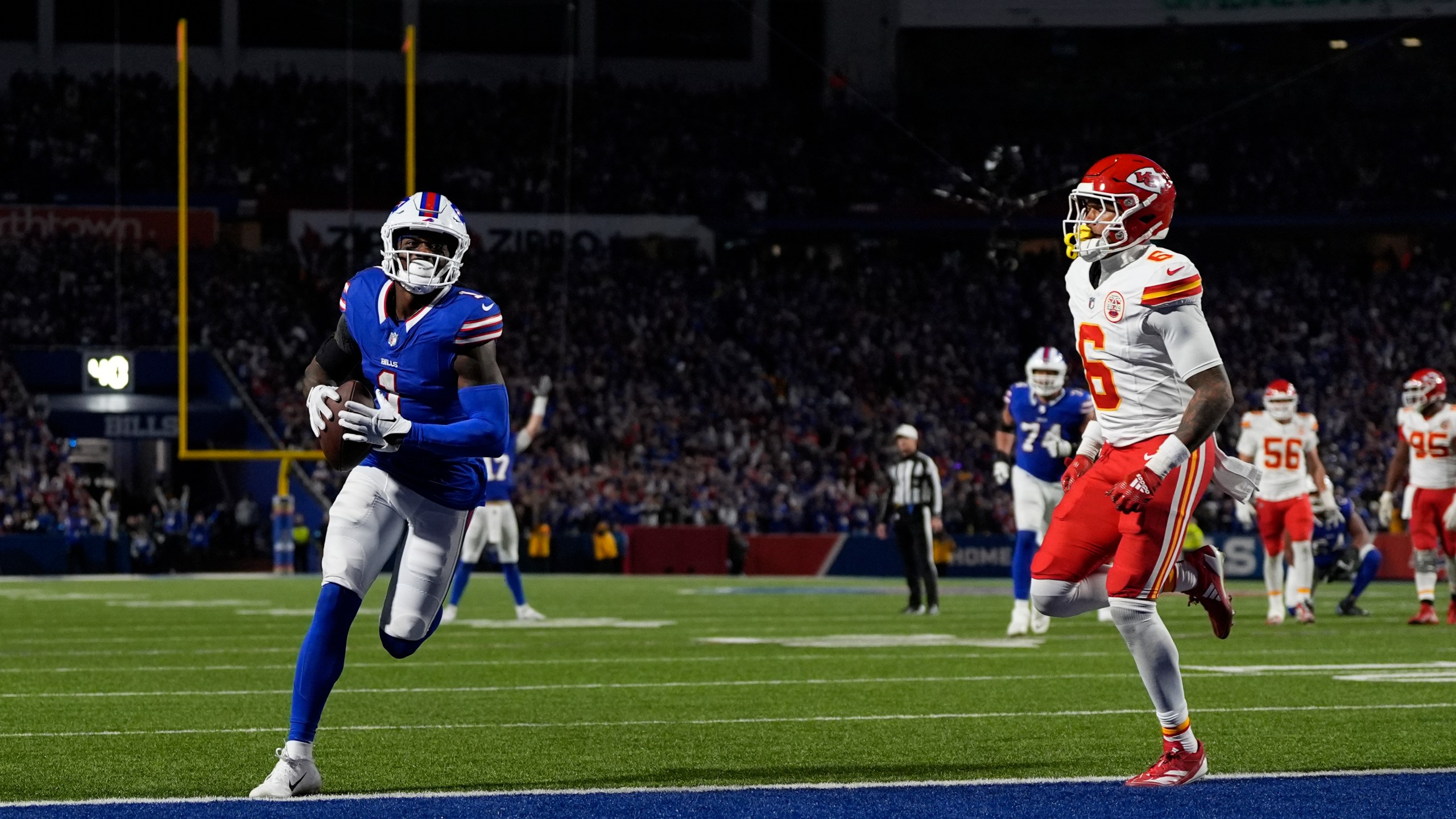 Buffalo Bills wide receiver Curtis Samuel scores past Kansas City Chiefs safety Bryan Cook (6) during the second half of an NFL football game Sunday, Nov. 17, 2024, in Orchard Park, N.Y. (AP Photo/Julia Demaree Nikhinson)