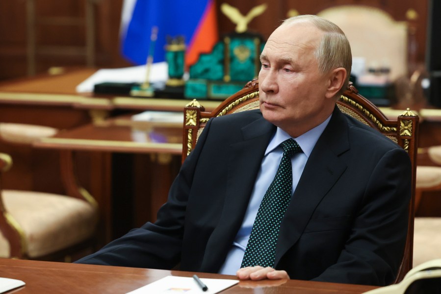 Russian President Vladimir Putin listens to Moscow-appointed head of Russian-controlled Zaporizhzhia region of Ukraine, Yevgeny Balitsky during their meeting at the Kremlin in Moscow, Russia, Monday, Nov. 18, 2024. (Vyacheslav Prokofyev, Sputnik, Kremlin Pool Photo via AP)