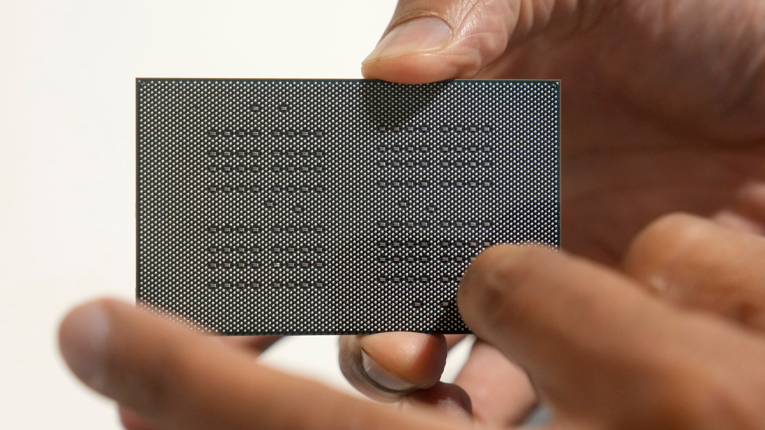 Sid Sheth, CEO and Co-founder of d-Matrix, holds up a d-Matrix Corsair chip during an interview in Santa Clara, Calif., Wednesday, Oct. 16, 2024. (AP Photo/Jeff Chiu)