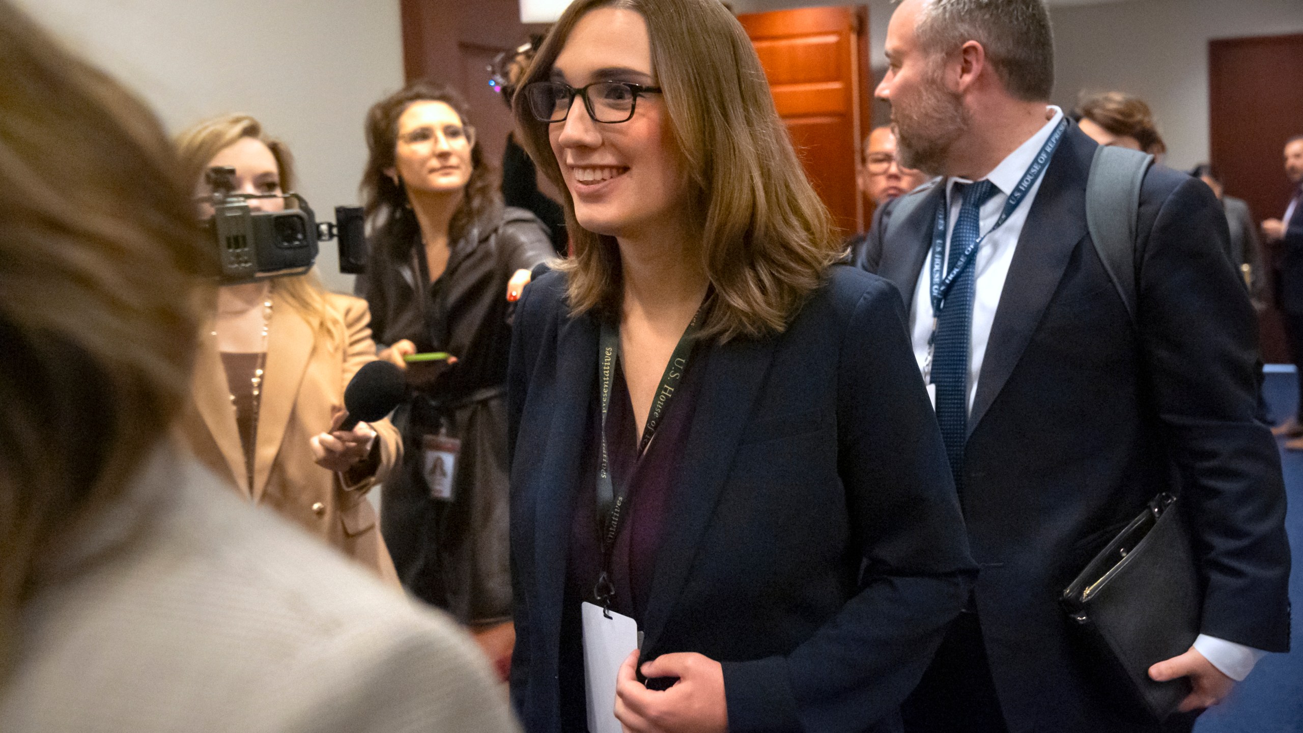 Rep.-elect Sarah McBride, D-Del., center, leaves a meeting of House Democrats on Capitol Hill, Tuesday, Nov. 19, 2024, in Washington. (AP Photo/Mark Schiefelbein)