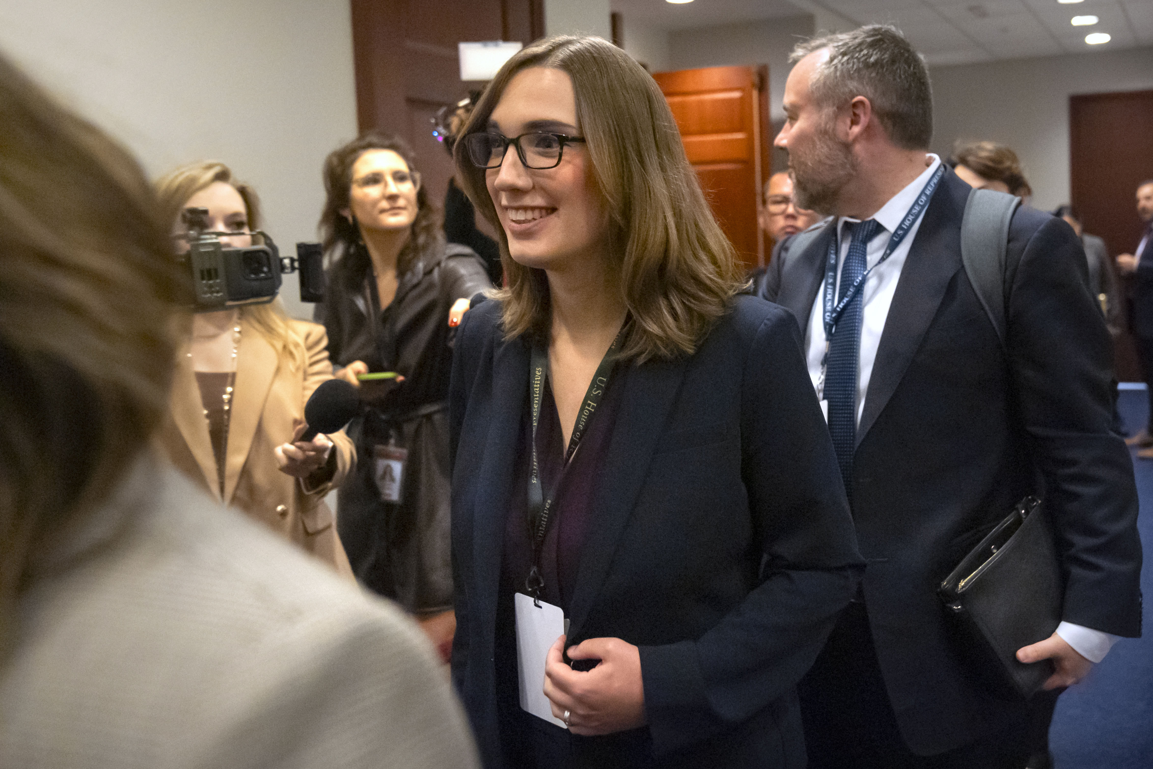 Rep.-elect Sarah McBride, D-Del., center, leaves a meeting of House Democrats on Capitol Hill, Tuesday, Nov. 19, 2024, in Washington. (AP Photo/Mark Schiefelbein)