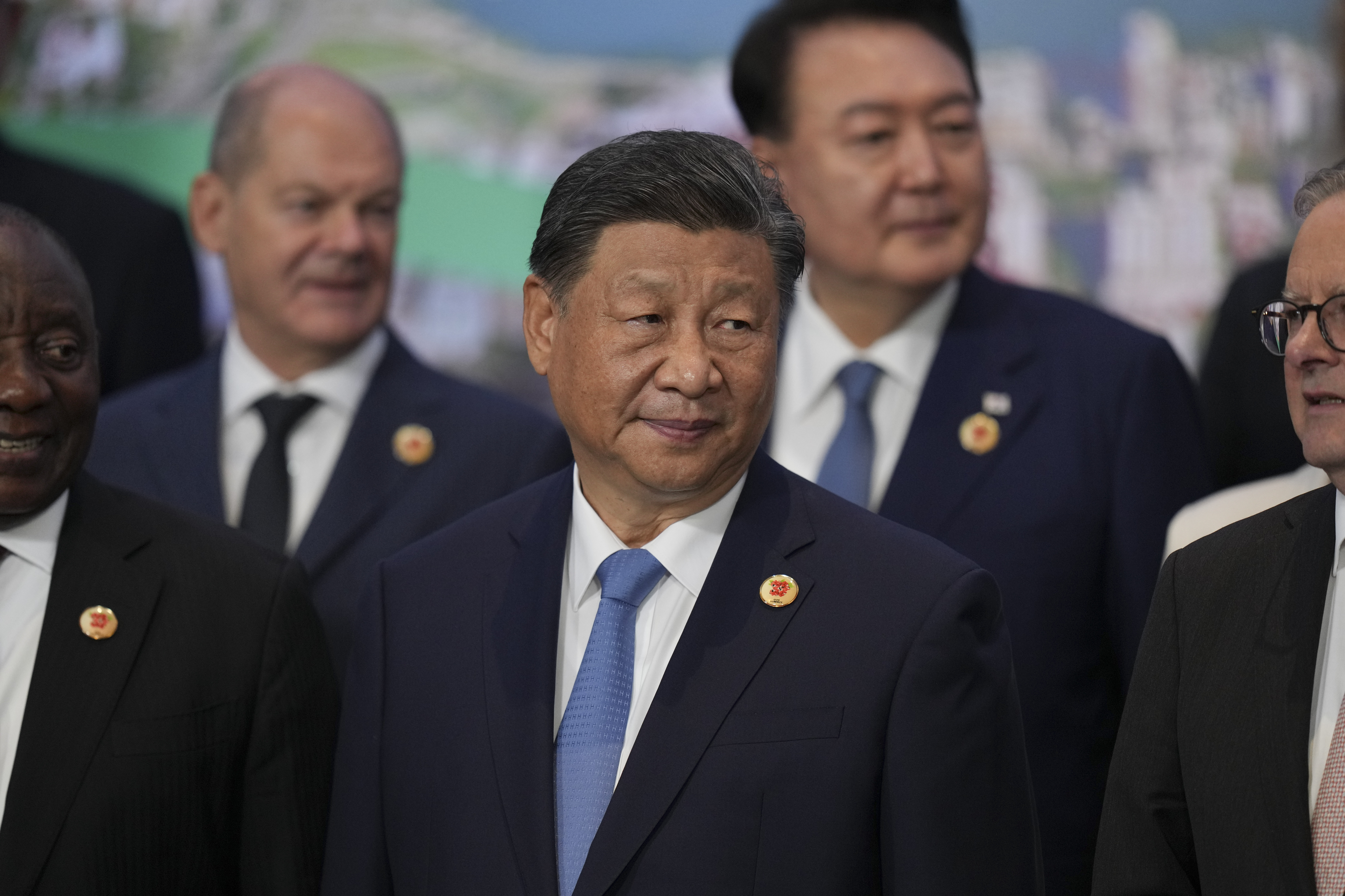 China's President Xi Jinping gathers for the world leaders' group photo at the G20 Summit, in Rio de Janeiro, Tuesday, Nov. 19, 2024. (AP Photo/Silvia Izquierdo)