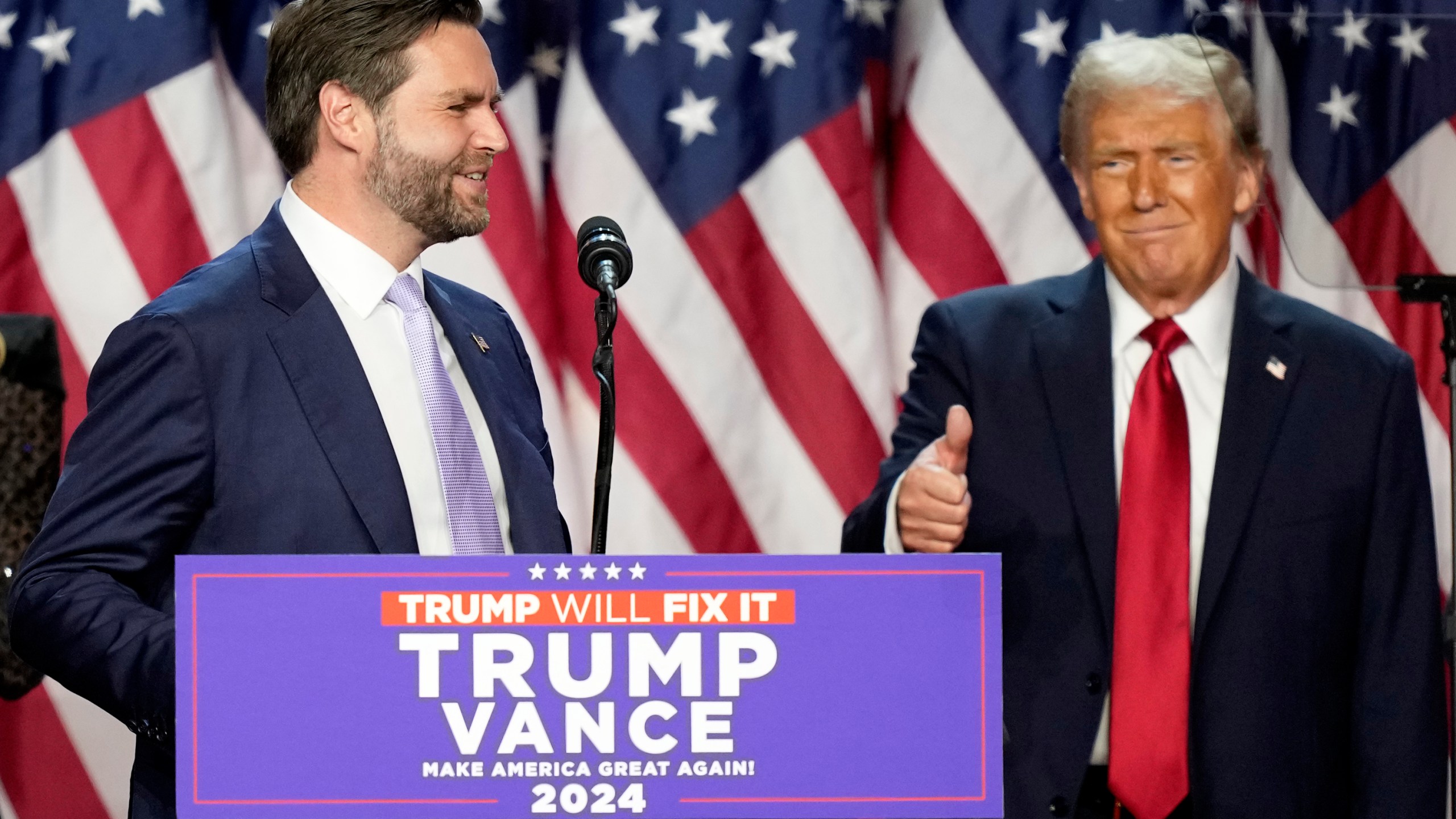 Republican presidential nominee former President Donald Trump gives a thumbs-up as Republican vice presidential nominee Sen. JD Vance, R-Ohio, speaks at an election night watch party, Wednesday, Nov. 6, 2024, in West Palm Beach, Fla. (AP Photo/Alex Brandon)