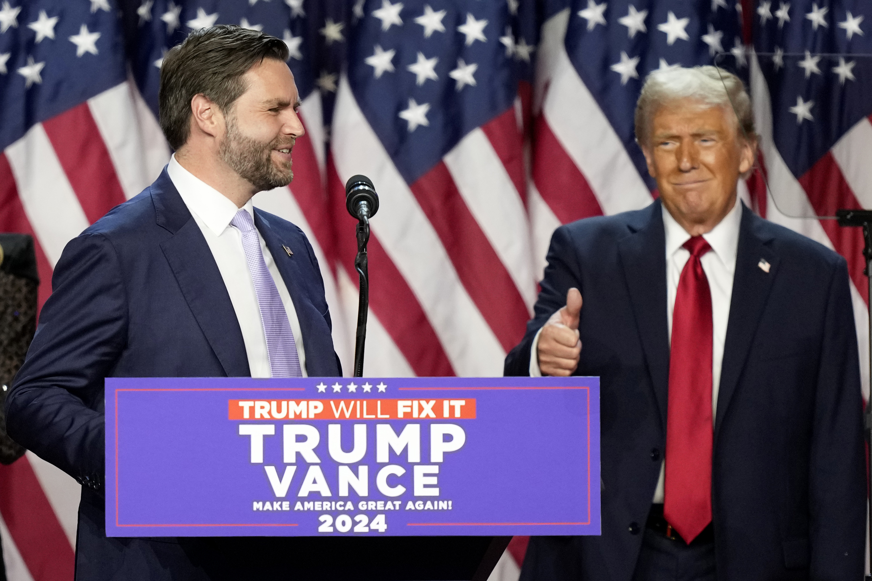 Republican presidential nominee former President Donald Trump gives a thumbs-up as Republican vice presidential nominee Sen. JD Vance, R-Ohio, speaks at an election night watch party, Wednesday, Nov. 6, 2024, in West Palm Beach, Fla. (AP Photo/Alex Brandon)