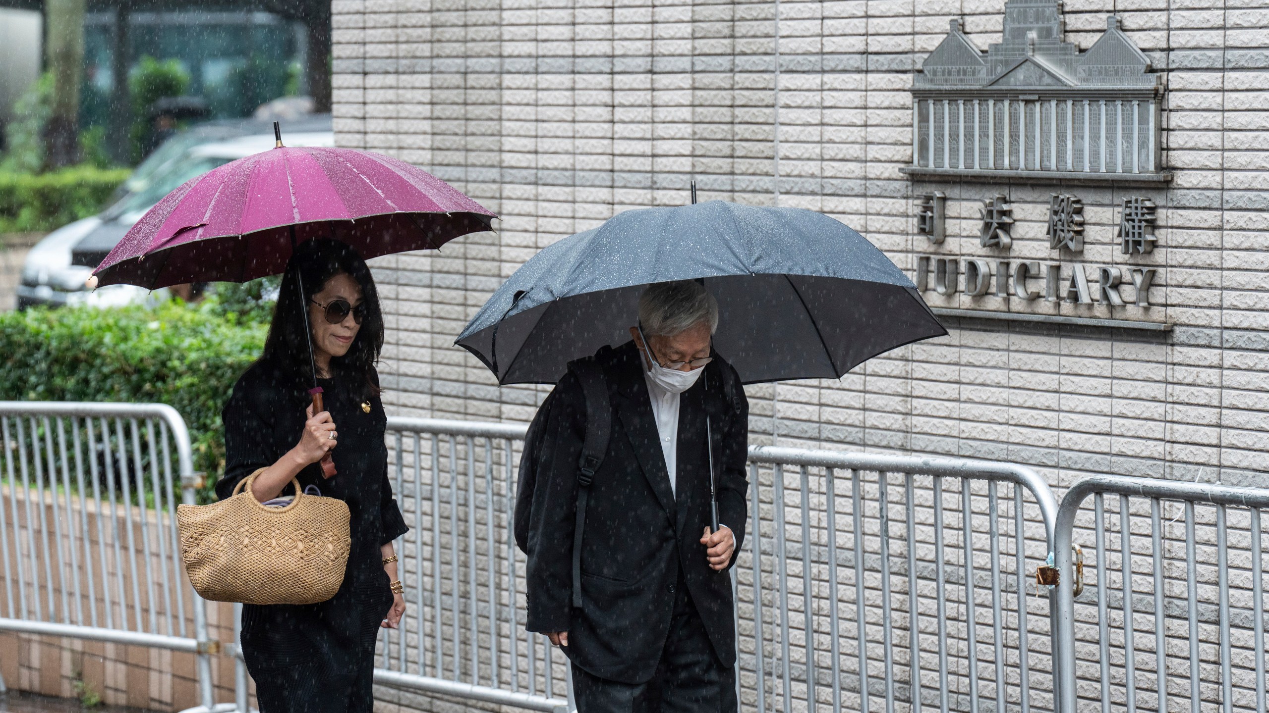 Jimmy Lai's wife Teresa Lai, left, and retired Chinese cardinal Joseph Zen Ze-Kiun arrive at West Kowloon Magistrates' Courts to attend Hong Kong activist publisher Lai's national security trial in Hong Kong, Wednesday, Nov. 20, 2024. (AP Photo/Chan Long Hei)