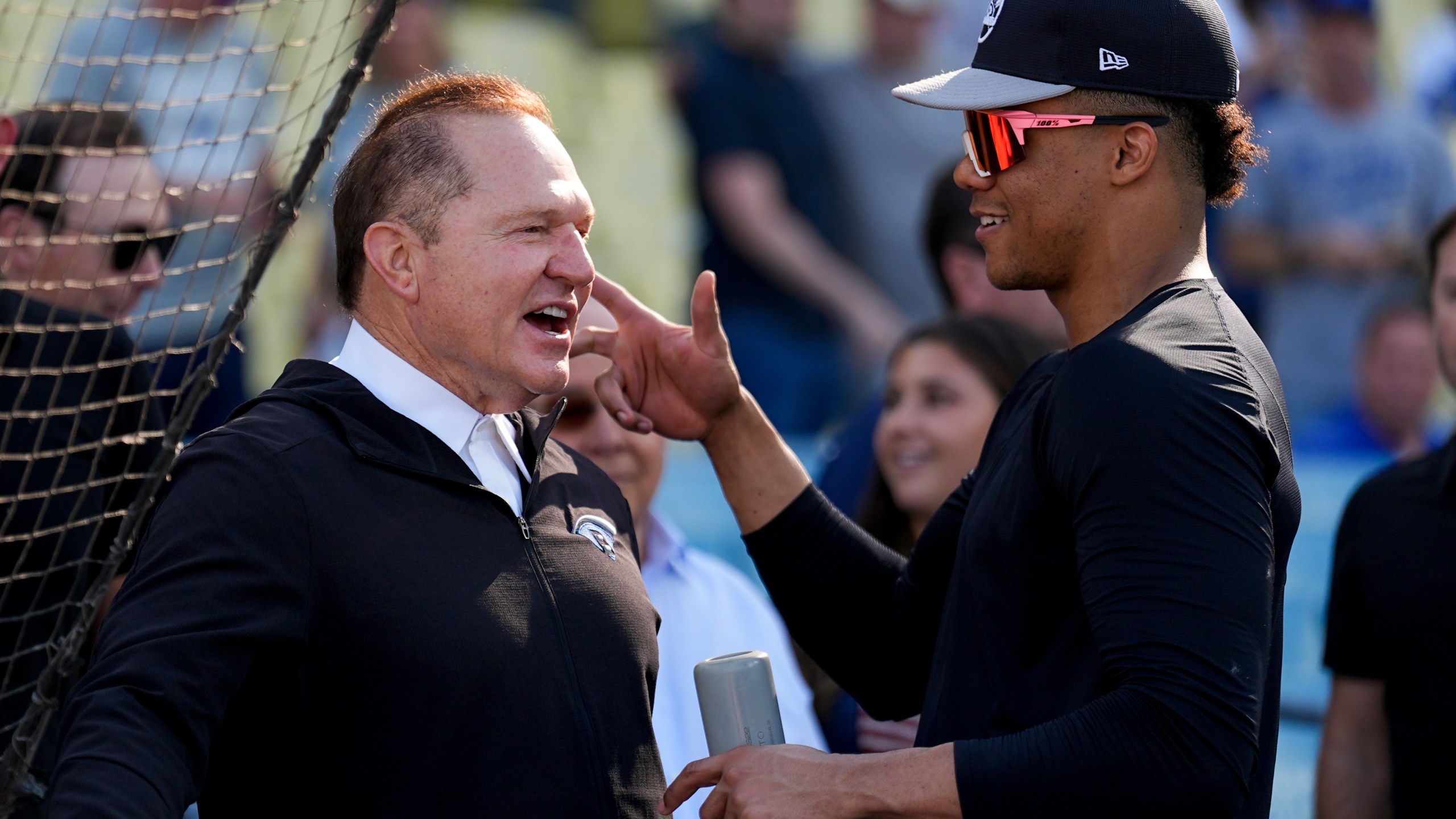 New York Yankees' Juan Soto talks with agent Scott Boras before Game 1 of the baseball World Series against the Los Angeles Dodgers, Friday, Oct. 25, 2024, in Los Angeles. (AP Photo/Julio Cortez)