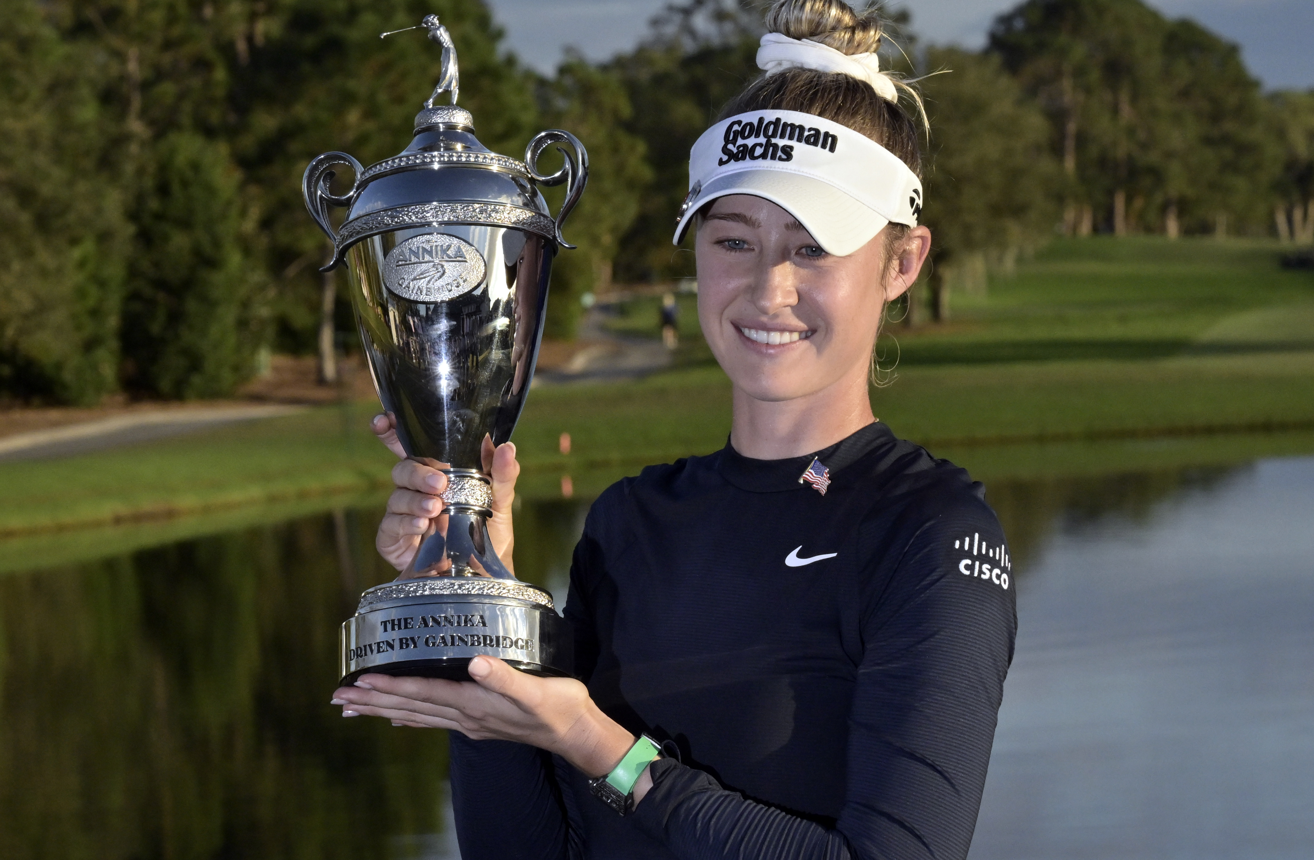 Nelly Korda holds the championship trophy after winning the the LPGA Annika golf tournament at Pelican Golf Club, Sunday, Nov. 17, 2024, in Belleair, Fla. (AP Photo/Steve Nesius)