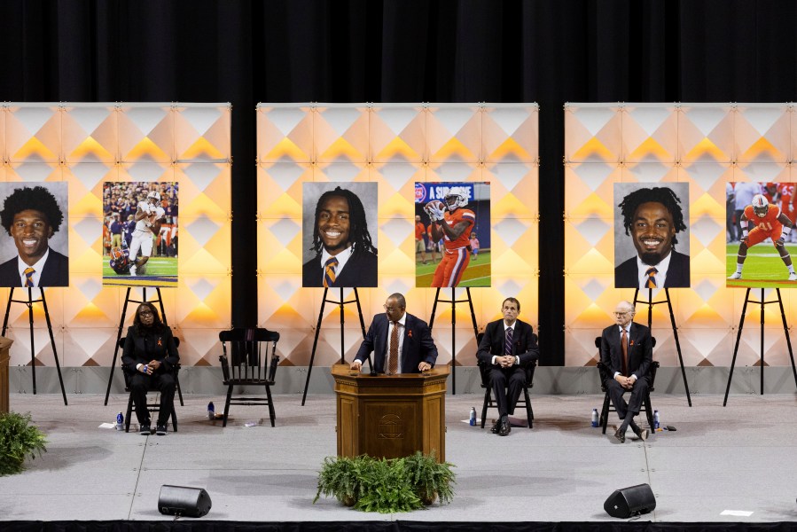 FILE - University of Virginia head football coach Tony Elliott speaks at a memorial service for Lavel Davis Jr., D’Sean Perry and Devin Chandler, Nov. 19, 2022, in Charlottesville, Va. (Mike Kropf/The Daily Progress via AP, File)