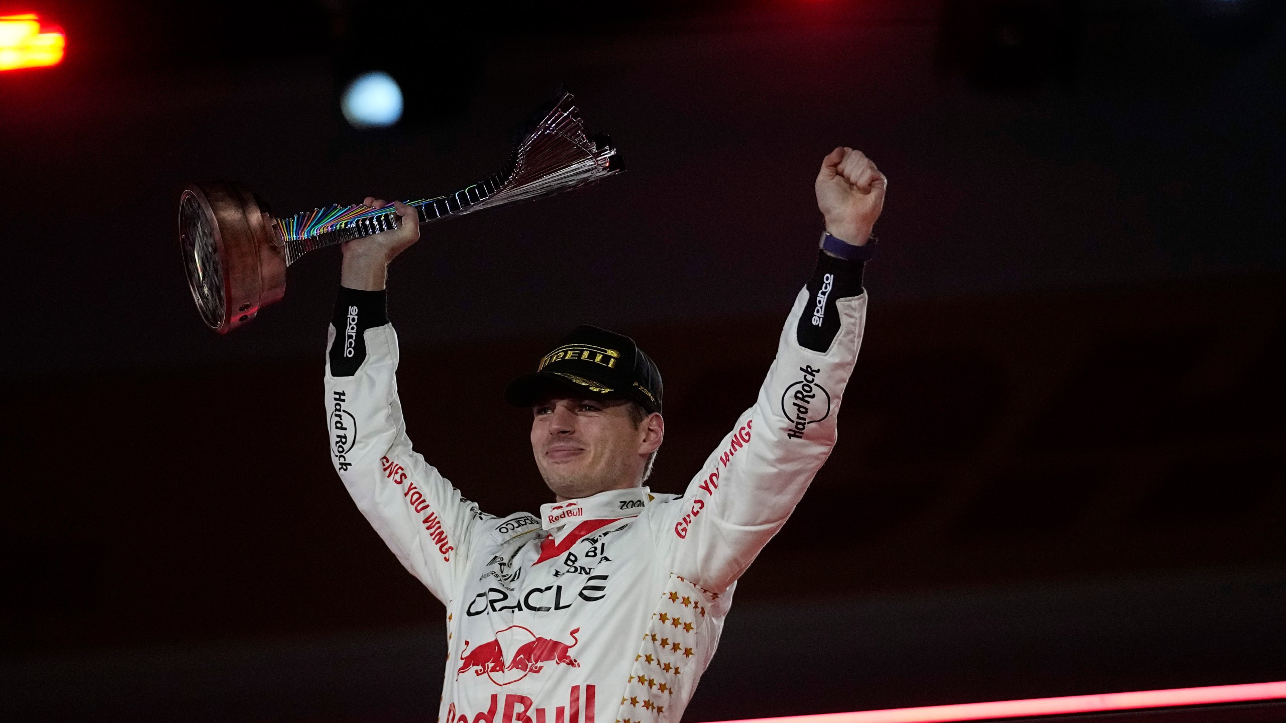 FILE - Red Bull driver Max Verstappen, of the Netherlands, celebrates on the podium after winning the Formula One Las Vegas Grand Prix auto race, Saturday, Nov. 18, 2023, in Las Vegas. (AP Photo/Darron Cummings, File)