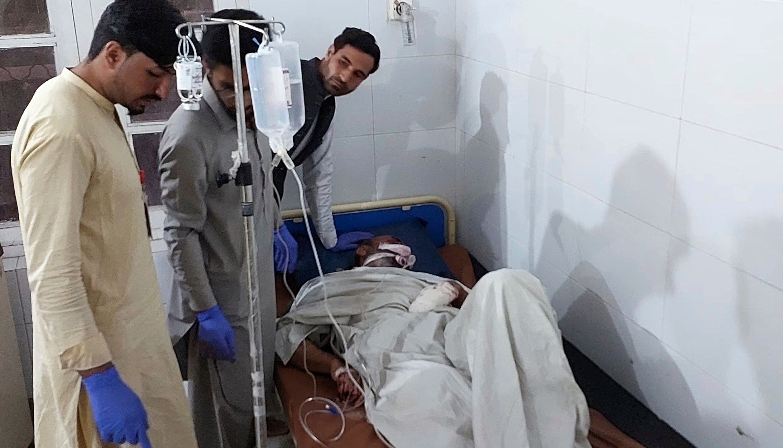 An injured victim of gunmen firing incident on passenger vehicles, is treated at a hospital in Parachinar, in Kurram district of Pakistan's northwestern Khyber Pakhtunkhwa province, Thursday, Nov. 21, 2024. (AP Photo/Dilawar Hussain)