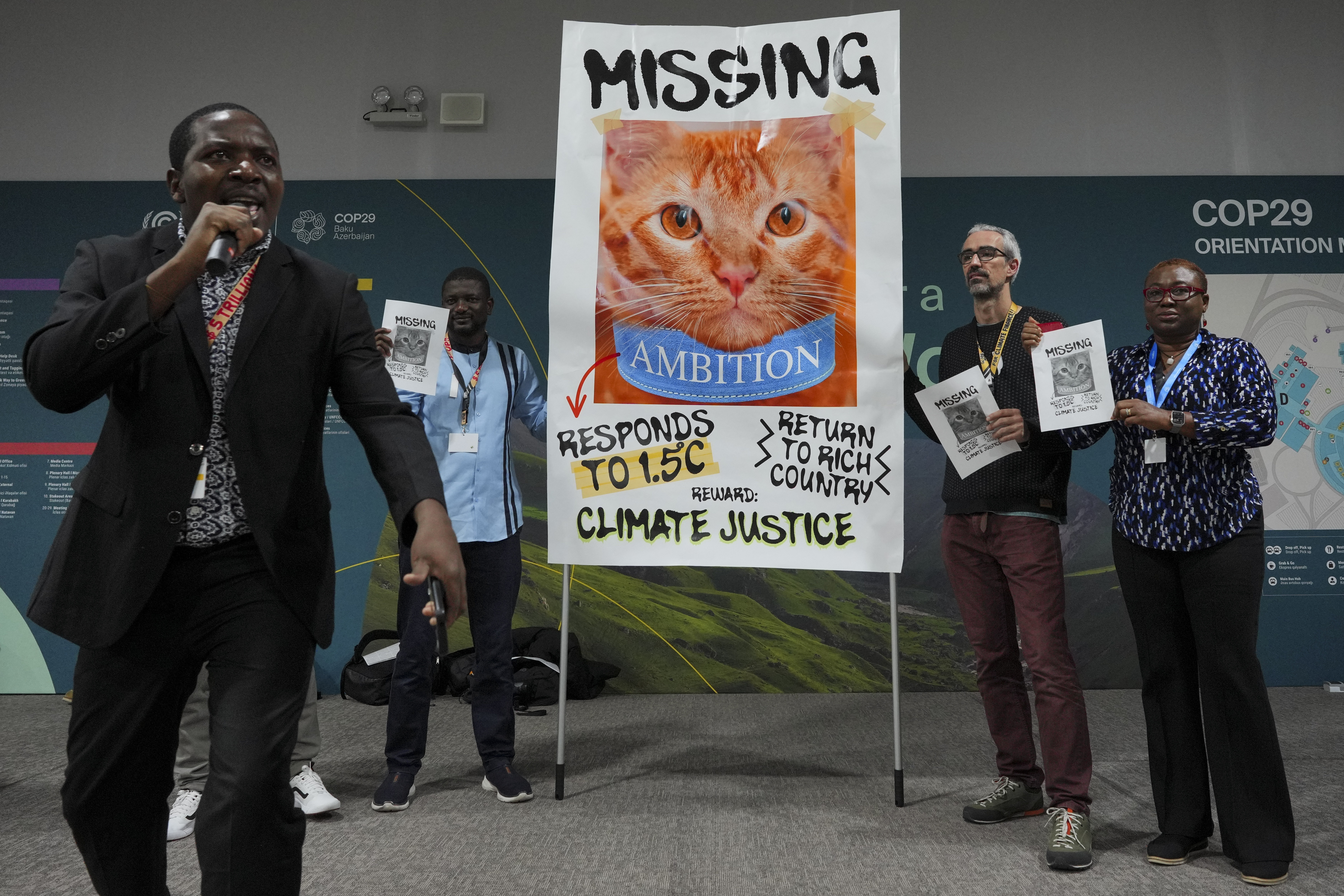 Activists participate in a demonstration for climate justice at the COP29 U.N. Climate Summit, Thursday, Nov. 21, 2024, in Baku, Azerbaijan. (AP Photo/Peter Dejong)