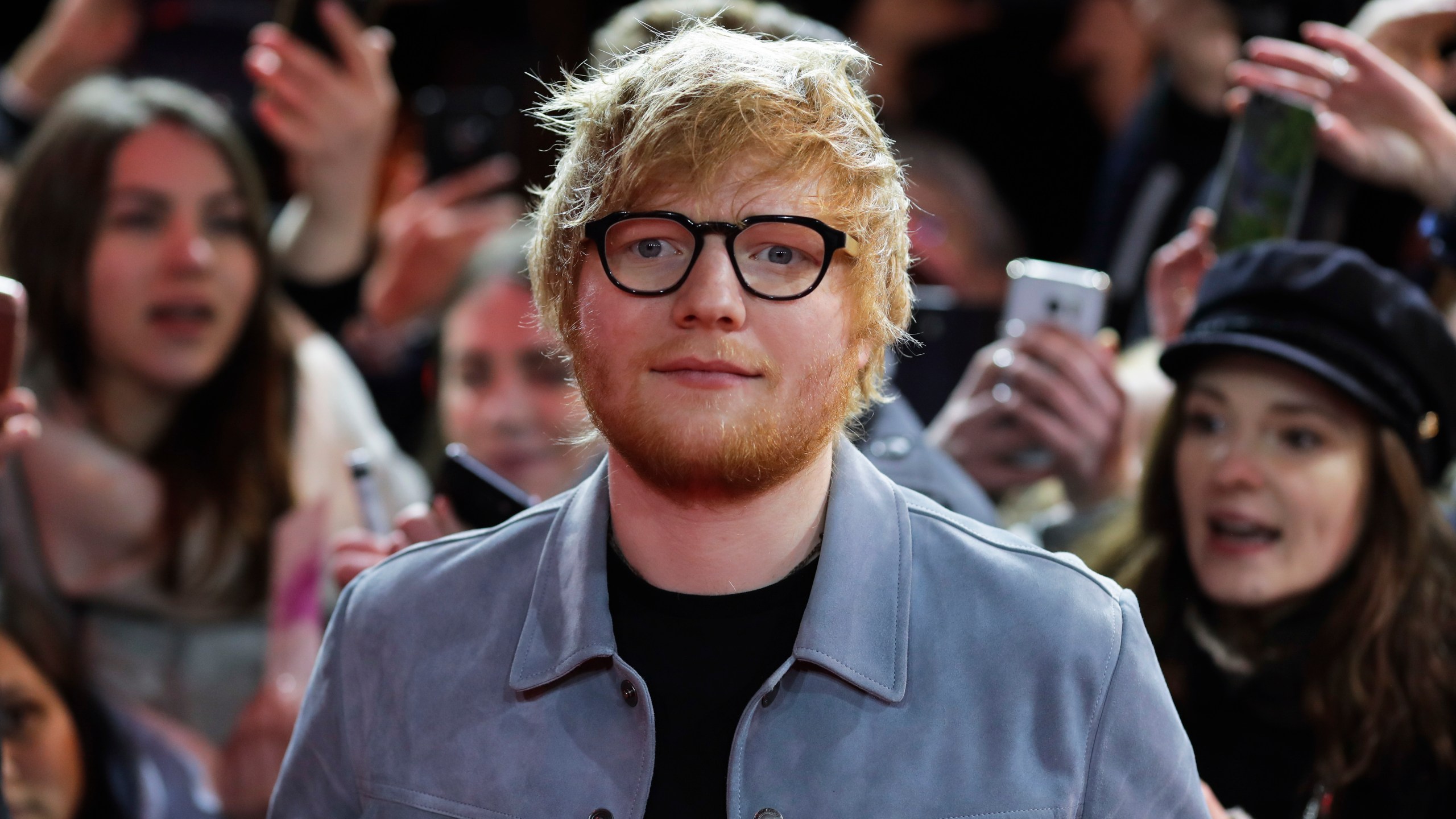 FILE - In this Friday, Feb. 23, 2018 file photo, singer-songwriter Ed Sheeran arrives for the screening of the film 'Songwriter' during the 68th edition of the International Film Festival Berlin, Berlinale, in Berlin, Germany. (AP Photo/Markus Schreiber, file)