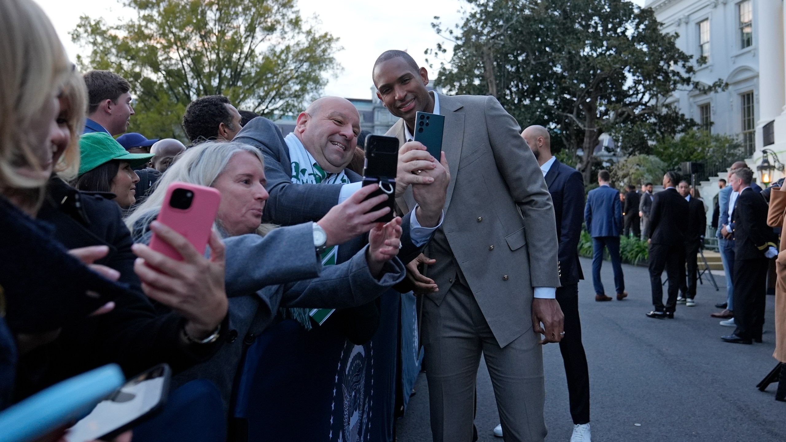 Boston Celtics Al Horford, center, poses with guests during an event with President Joe Biden to celebrate the Celtics victory in the 2024 National Basketball Association Championship, on the South Lawn of the White House in Washington, Thursday, Nov. 21, 2024. (AP Photo/Susan Walsh)