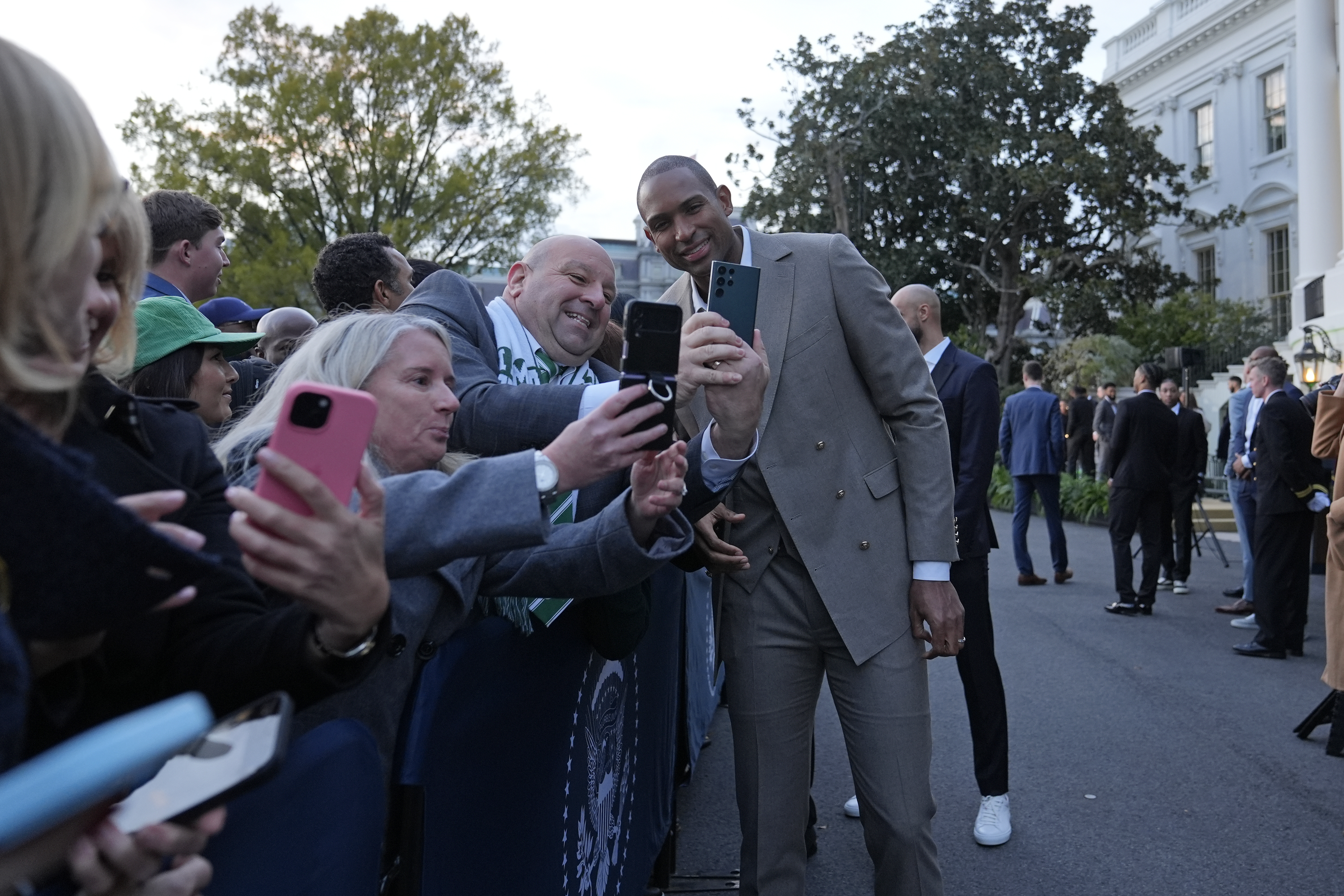 Boston Celtics Al Horford, center, poses with guests during an event with President Joe Biden to celebrate the Celtics victory in the 2024 National Basketball Association Championship, on the South Lawn of the White House in Washington, Thursday, Nov. 21, 2024. (AP Photo/Susan Walsh)