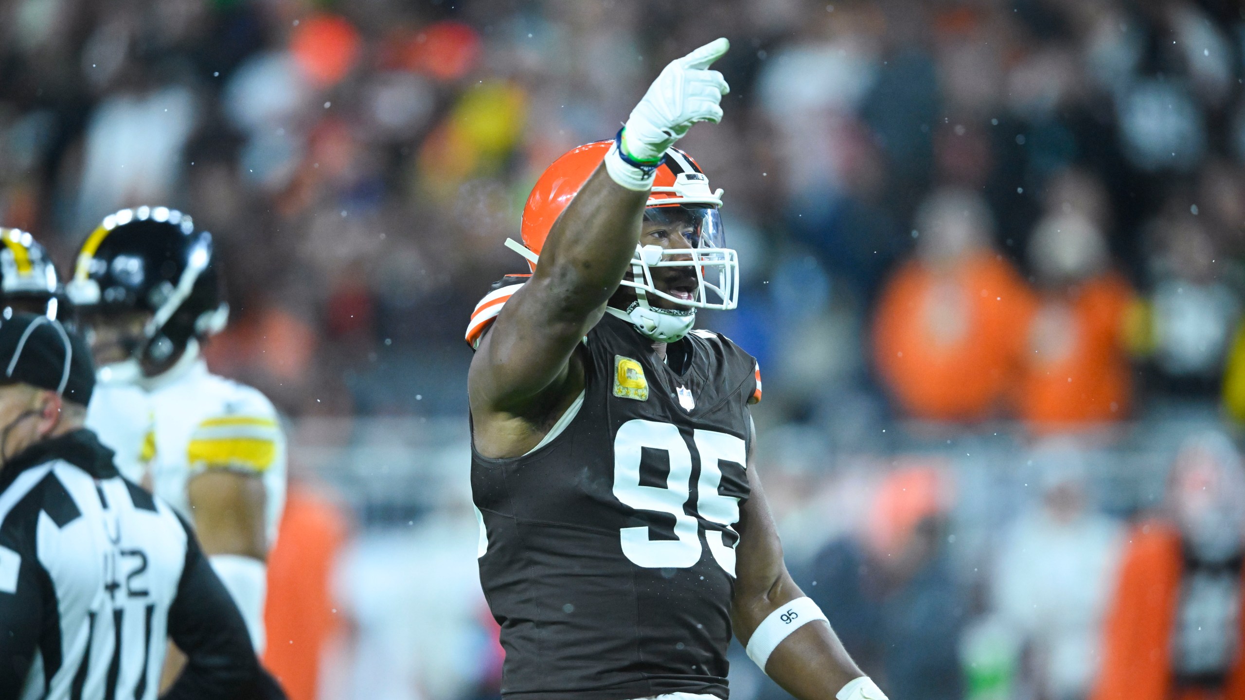 Cleveland Browns defensive end Myles Garrett (95) reacts after a defensive stop in the first half of an NFL football game against the Pittsburgh Steelers, Thursday, Nov. 21, 2024, in Cleveland. (AP Photo/David Richard)