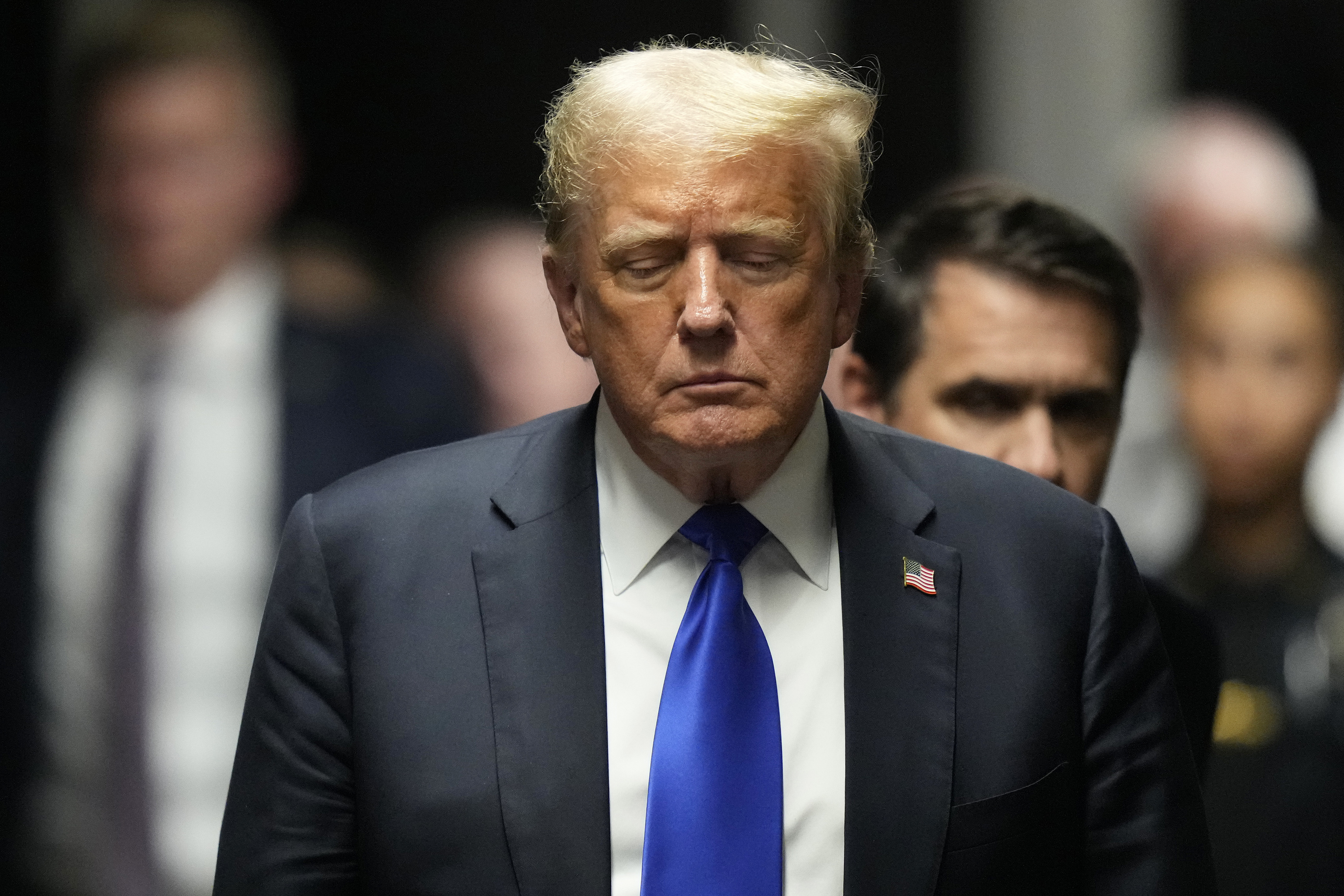 FILE - Former President Donald Trump walks to make comments to members of the media after a jury convicted him of felony crimes for falsifying business records in a scheme to illegally influence the 2016 election, at Manhattan Criminal Court, May 30, 2024, in New York. (AP Photo/Seth Wenig, Pool, File)