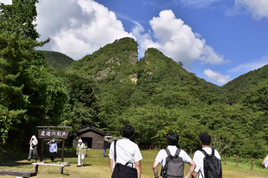 People visit remains of a Sado gold mine are seen on Sado Island, northern Japan, on Aug. 26, 2024. (Yasufumi Fujita/Kyodo News via AP)