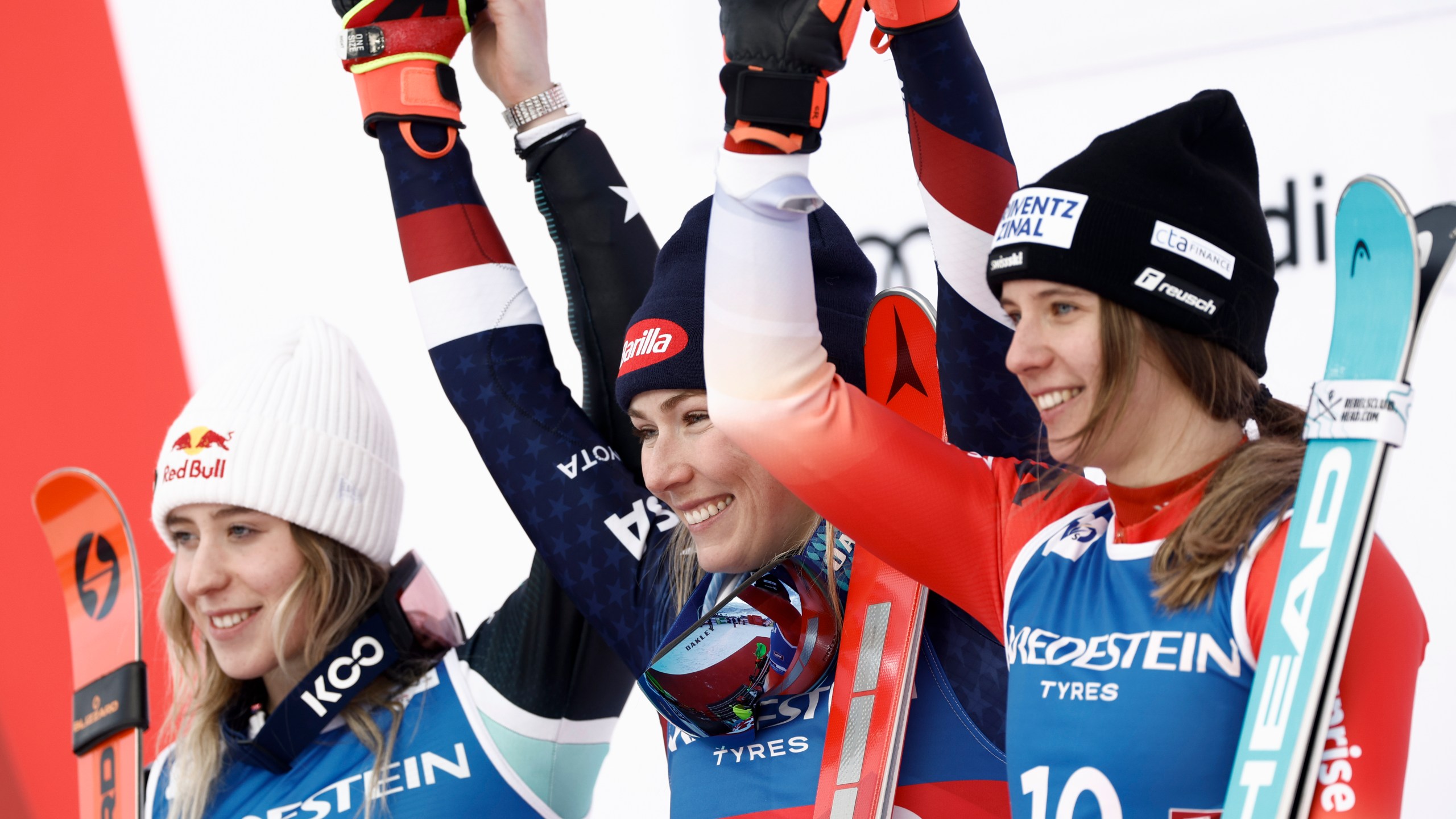 United States' Mikaela Shiffrin, center, winner of an alpine ski, women's World Cup slalom, celebrates with second-placed Albania's Lara Colturi, left, and third-placed Switzerland's Camille Rast, in Gurgl, Austria, Saturday, Nov. 23, 2024. (AP Photo/Gabriele Facciotti)