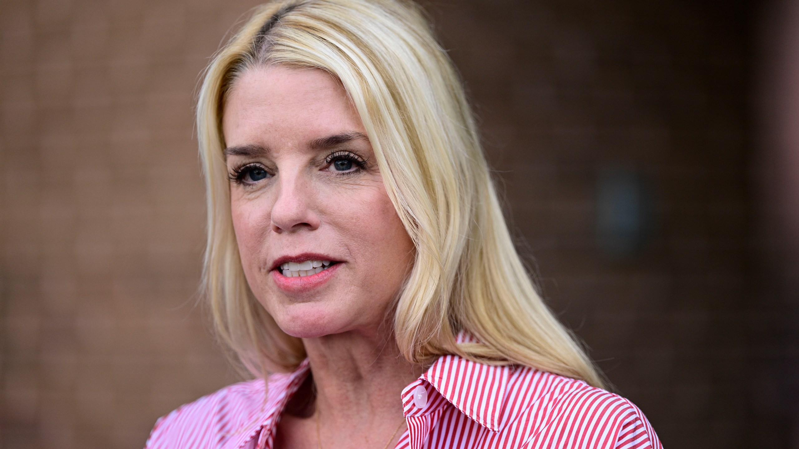 FILE - Pam Bondi, former Florida Attorney General, speaks to reporters outside an election integrity volunteer training, June 18, 2024, in Newtown, Pa. (AP Photo/Derik Hamilton, File)