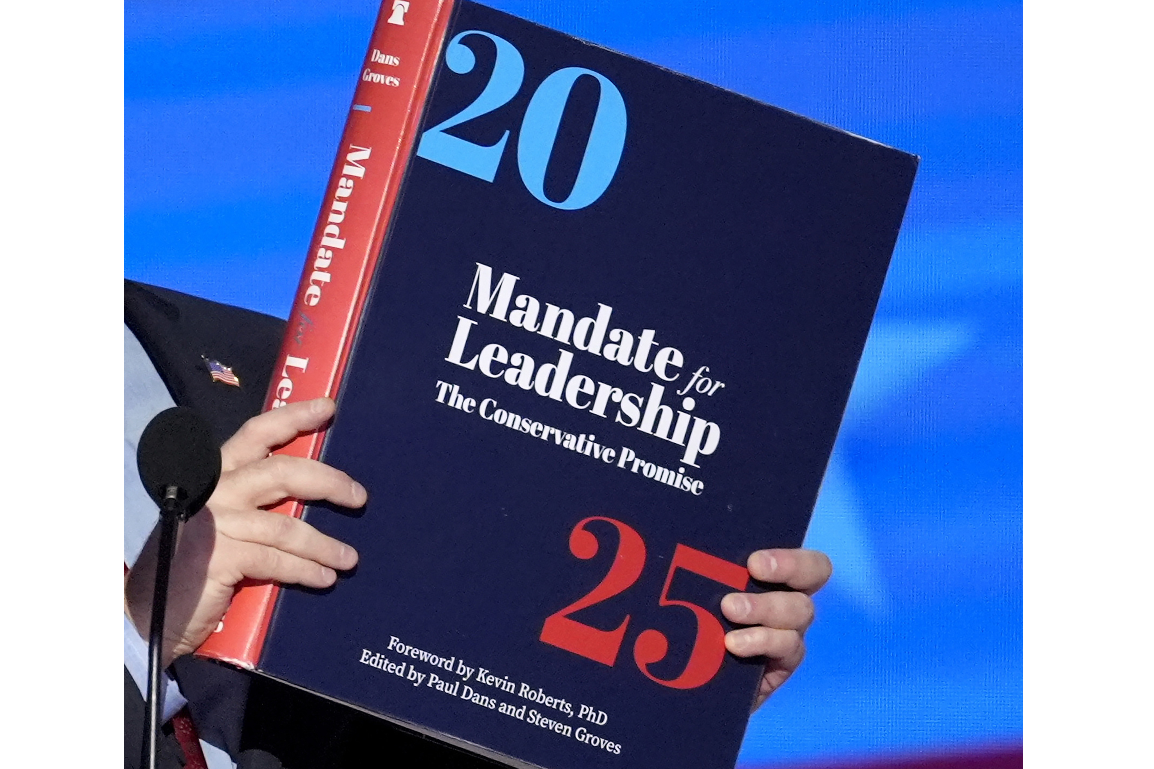 FILE - A copy of Project 2025 is held during the Democratic National Convention, Aug. 21, 2024, in Chicago. (AP Photo/J. Scott Applewhite, File)