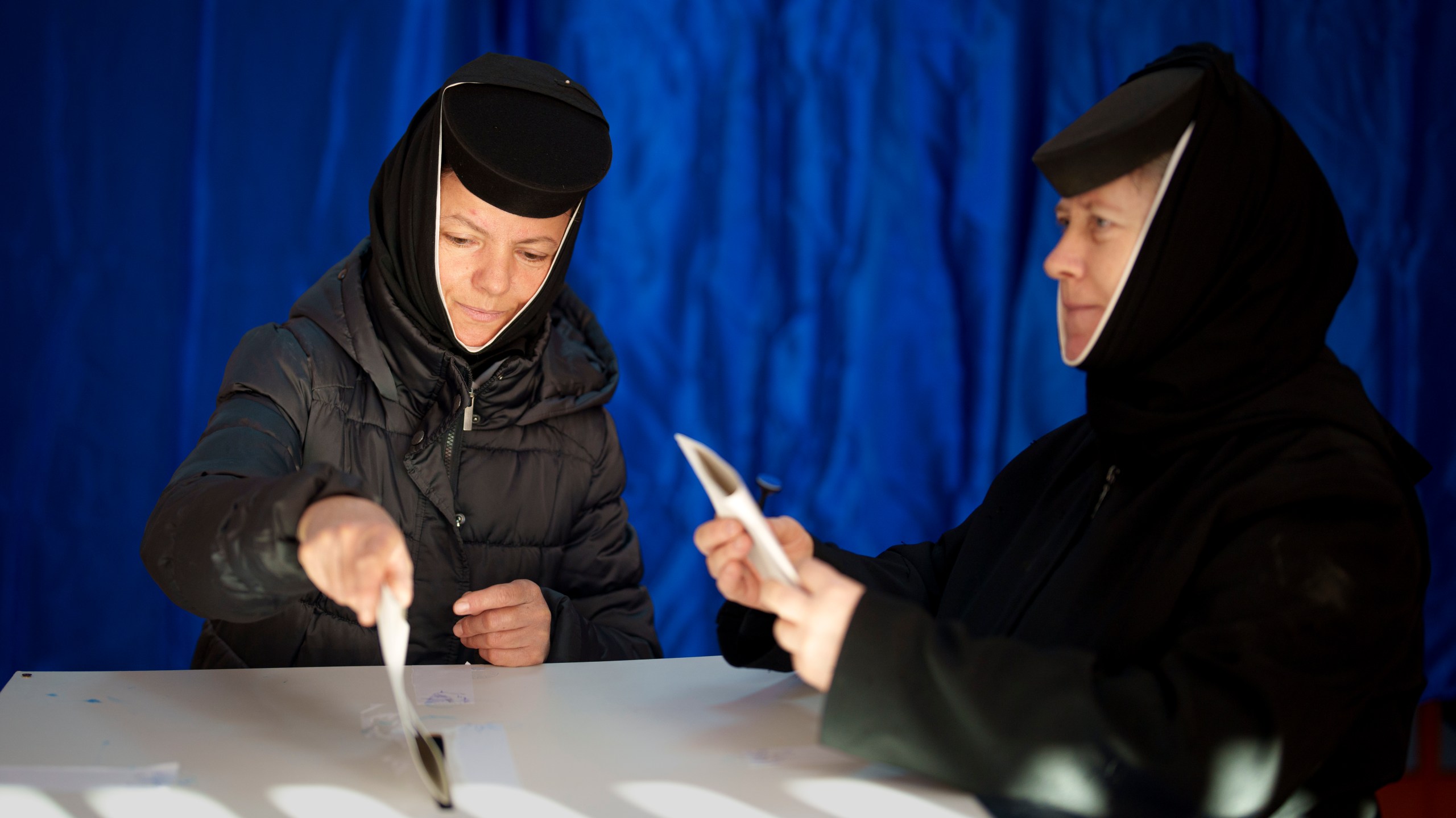 Orthodox nuns cast their vote in the country's presidential elections, in Pasarea, Romania, Sunday, Nov. 24, 2024. (AP Photo/Vadim Ghirda)