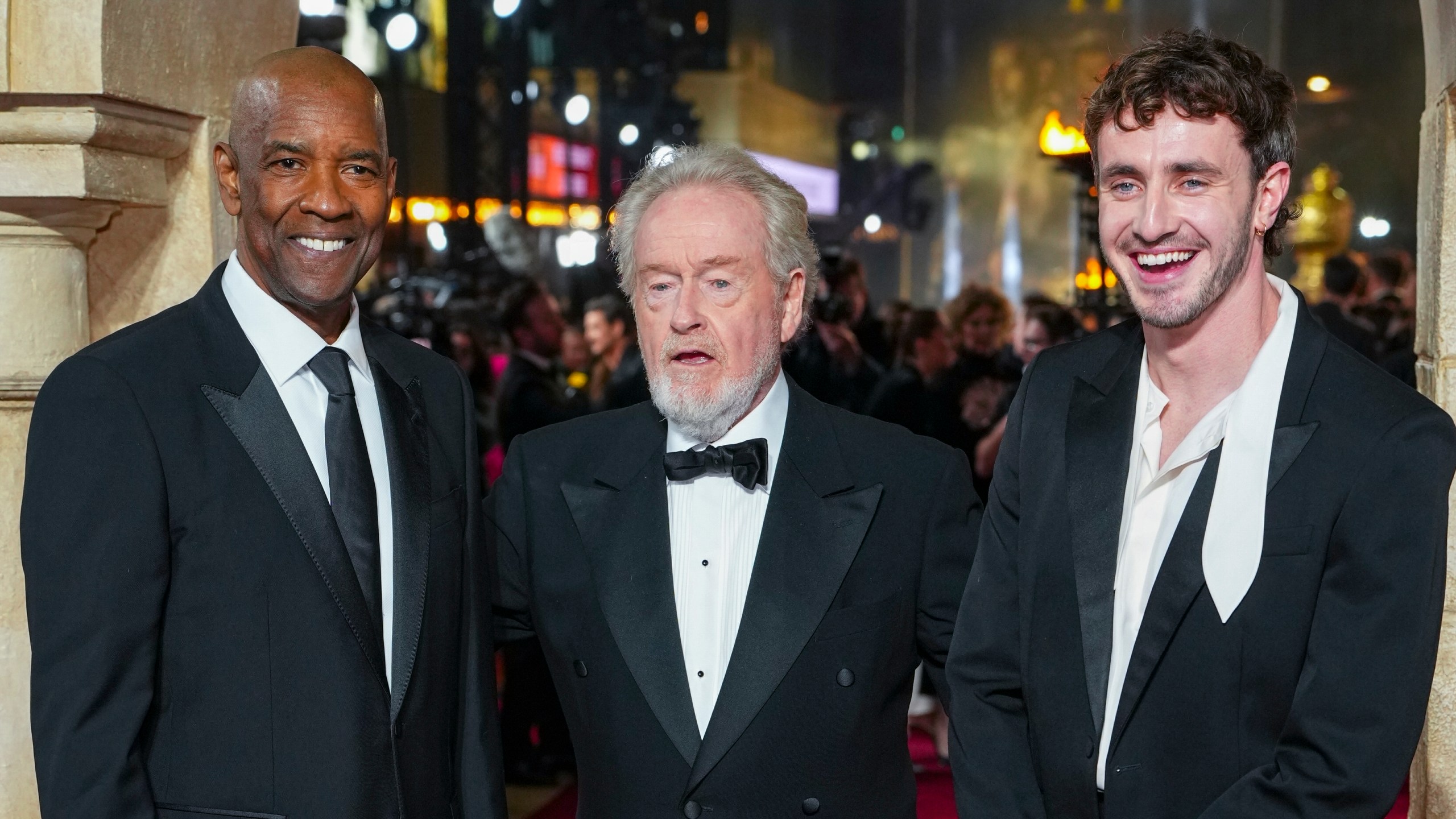 Denzel Washington, from left, director Ridley Scott, left, and Paul Mescal pose for photographers upon arrival at the premiere of the film 'Gladiator II' on Wednesday, Nov. 13, 2024, in London. (Photo by Scott A Garfitt/Invision/AP)