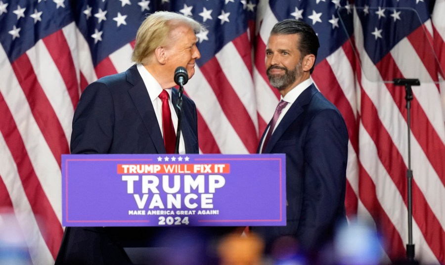 FILE - Republican presidential nominee former President Donald Trump, left, looks at his son Donald Trump Jr. at an election night watch party, Nov. 6, 2024, in West Palm Beach, Fla. (AP Photo/Alex Brandon, File)