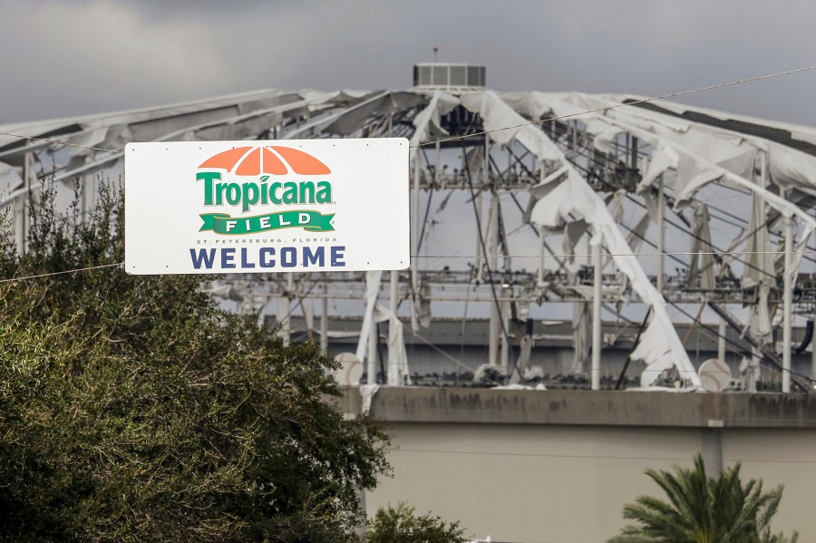 FILE - Signage at the entrance to the parking lot of Tropicana Field where the roof was torn off during Hurricane Milton on Thursday, Oct. 10, 2024, in St. Petersburg, Fla. (AP Photo/Mike Carlson, File)