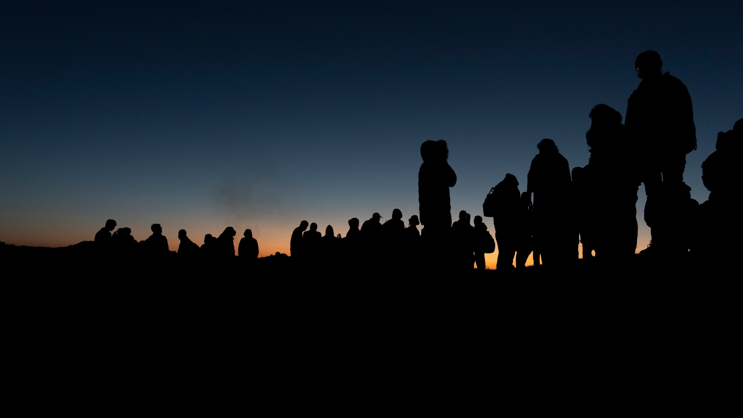 FILE - Chinese migrants wait to be processed after crossing the border with Mexico May 8, 2024, near Jacumba Hot Springs, Calif. (AP Photo/Ryan Sun, File)