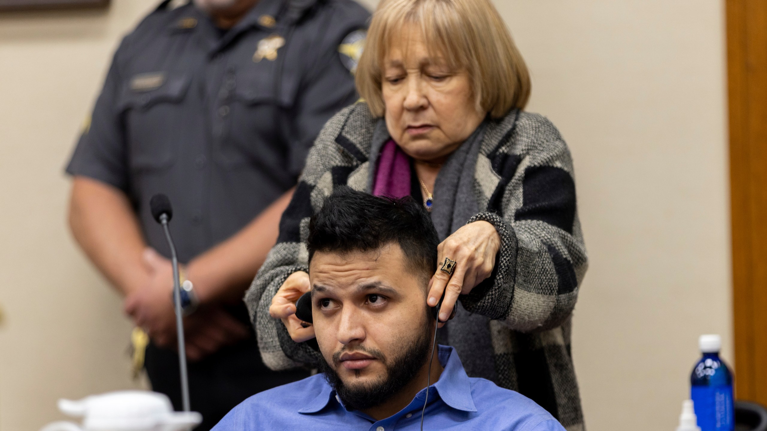 FILE - A translator assists Venezuelan Jose Ibarra with headphones during his murder trial at the Athens-Clarke County Superior Court, in Athens, Ga., Nov. 19, 2024. (Arvin Temkar/Atlanta Journal-Constitution via AP File)