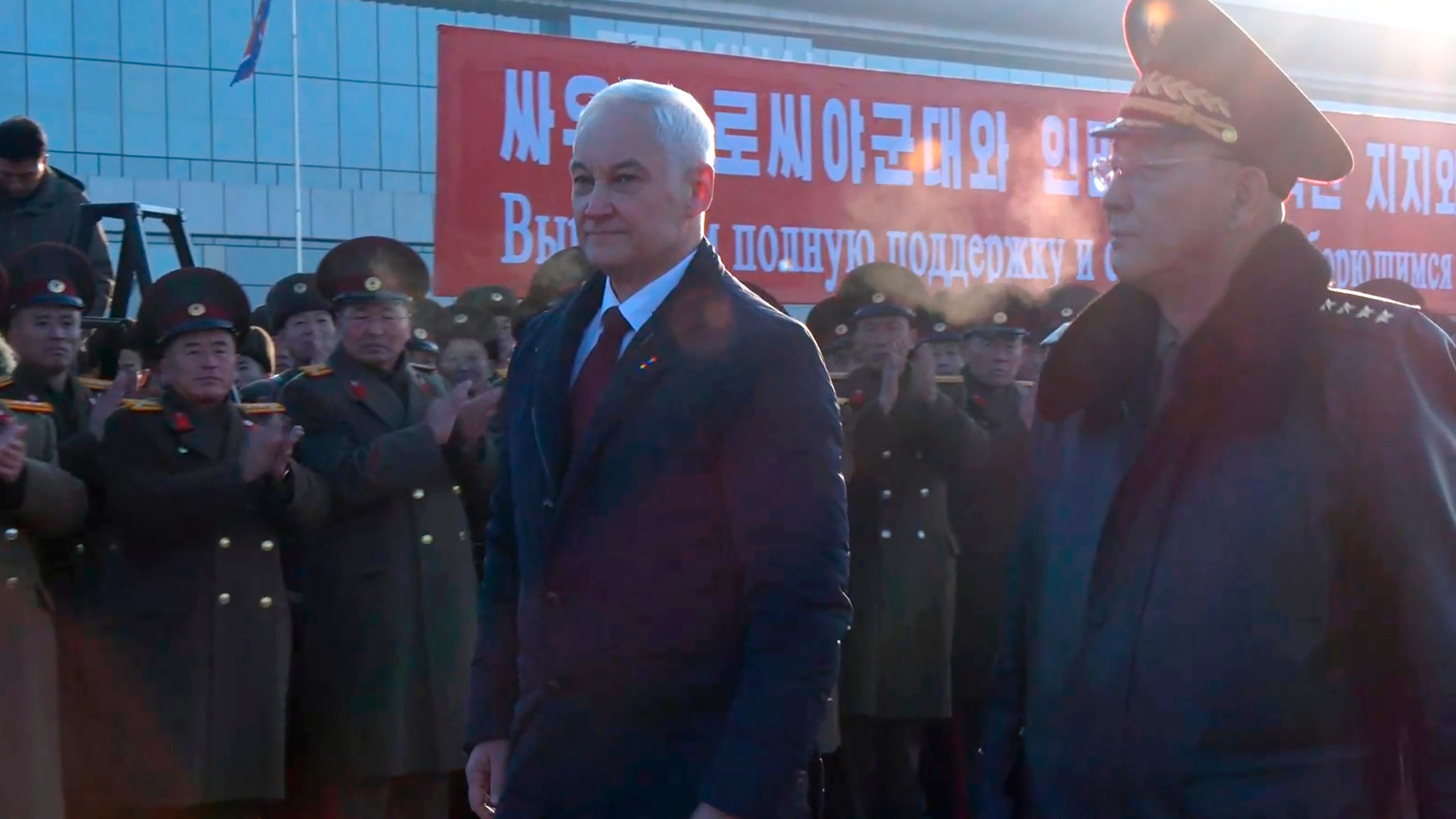 In this photo taken from a video released by Russian Defense Ministry press service, Russian Defense Minister Andrei Belousov, left, is welcomed by North Korean Defense Minister No Kwang Chol upon his arrival at Pyongyang International Airport outside of Pyongyang, North Korea Friday, Nov. 29, 2024. (Russian Defense Press Service via AP)