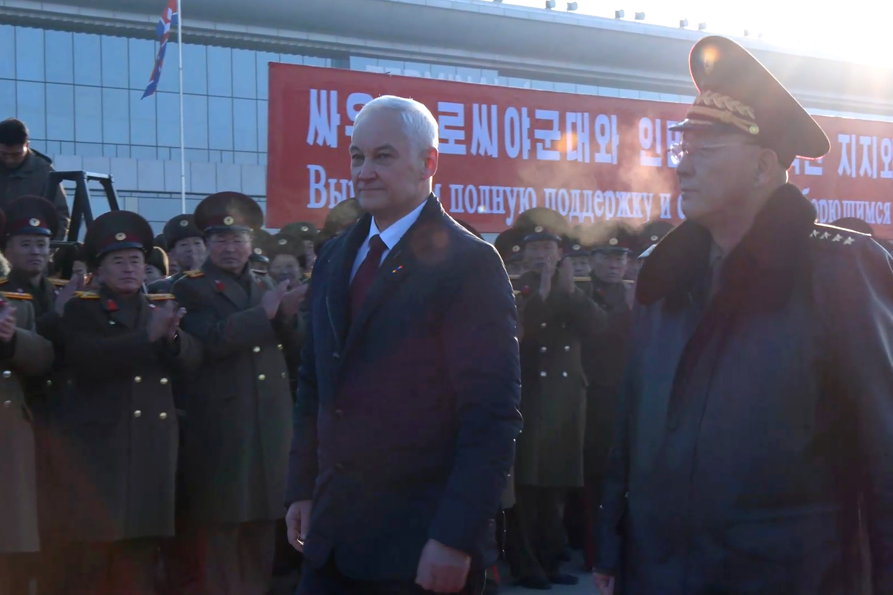 In this photo taken from a video released by Russian Defense Ministry press service, Russian Defense Minister Andrei Belousov, left, is welcomed by North Korean Defense Minister No Kwang Chol upon his arrival at Pyongyang International Airport outside of Pyongyang, North Korea Friday, Nov. 29, 2024. (Russian Defense Press Service via AP)